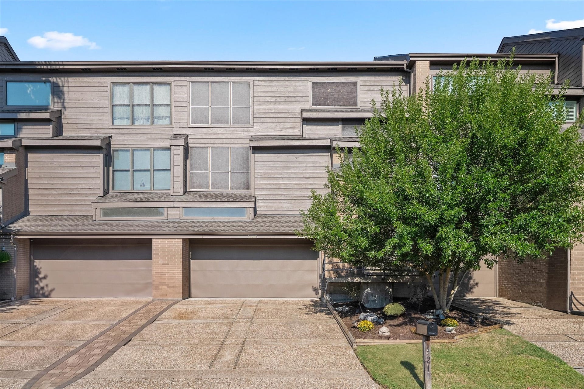 18217 Sandy Cove, Houston, TX 77058 Striking curb appeal highlighting the home's contemporary facade.