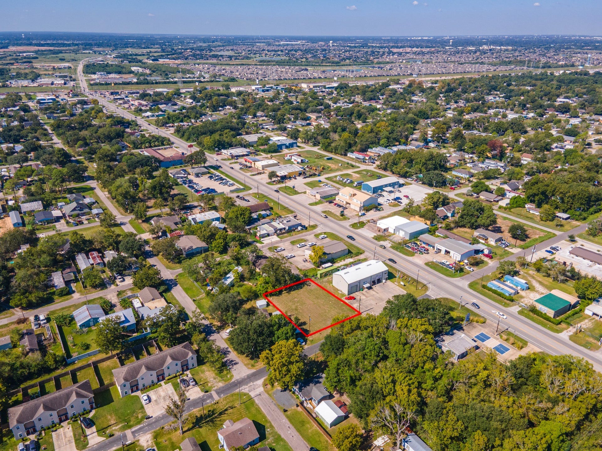 4618 11th Street, Bacliff, TX 77518 Wider aerial view showing the lot and surrounding roads and neighborhood.