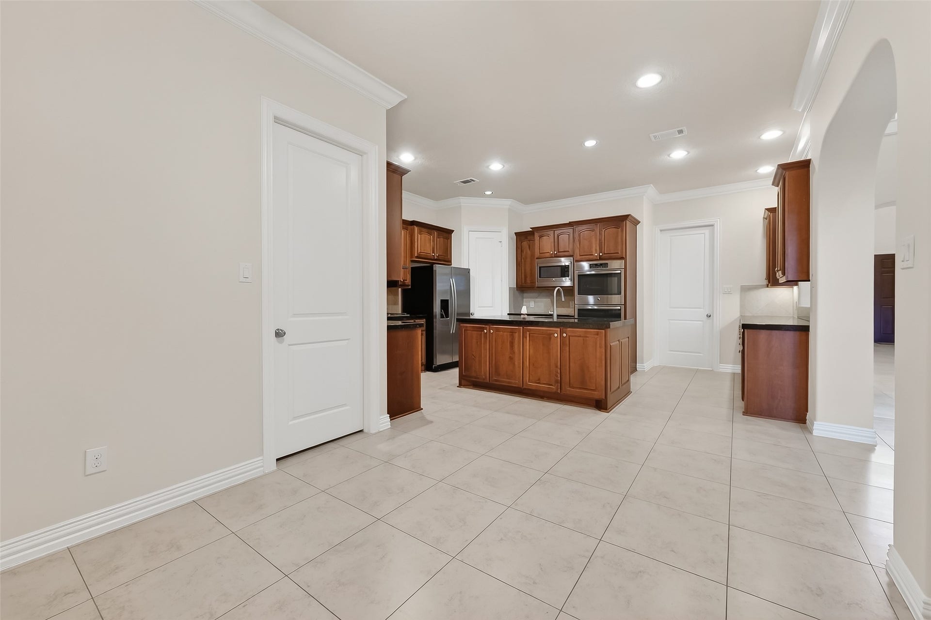 14447 KINGSTON COVE Lane, Houston, TX 77077 Access to the 3 car garage donveniently located by the kitchen.