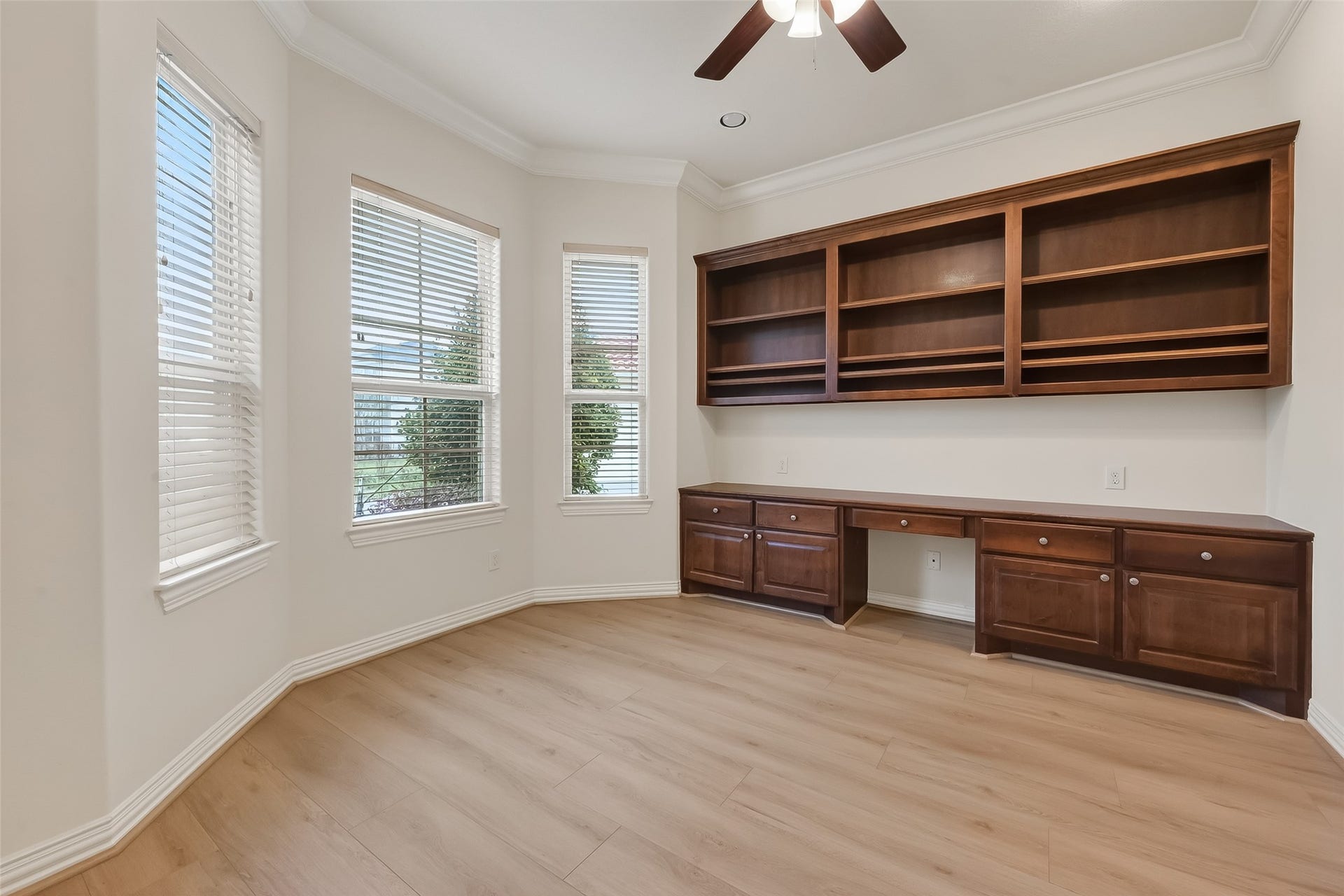 14447 KINGSTON COVE Lane, Houston, TX 77077 Study offers great views of front yard, nice built in desk and bookshelf with variable shelves.