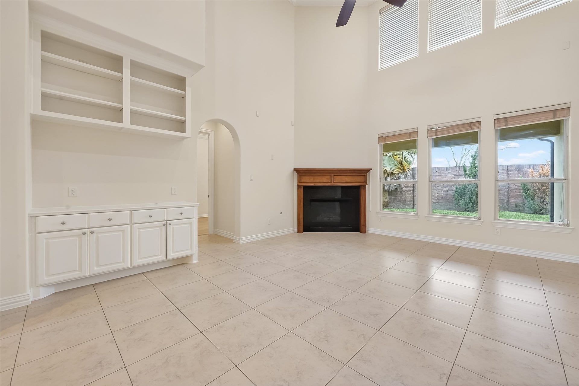 14447 KINGSTON COVE Lane, Houston, TX 77077 Main Living Room presents a double height ceiling and offers great views of the covered veranda.