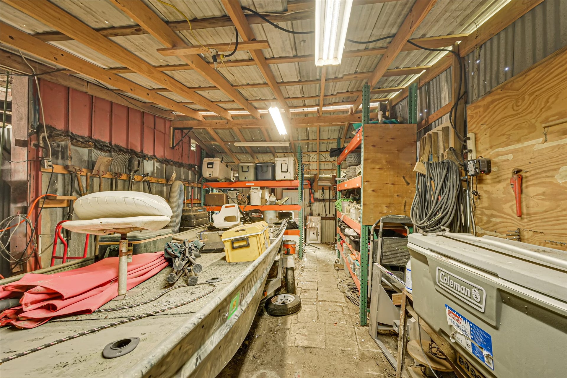 121 Patterson Road, #CR814, Brazoria, TX 77422 Spacious utility shed with ample shelving, perfect for storing tools, equipment, or outdoor gear.