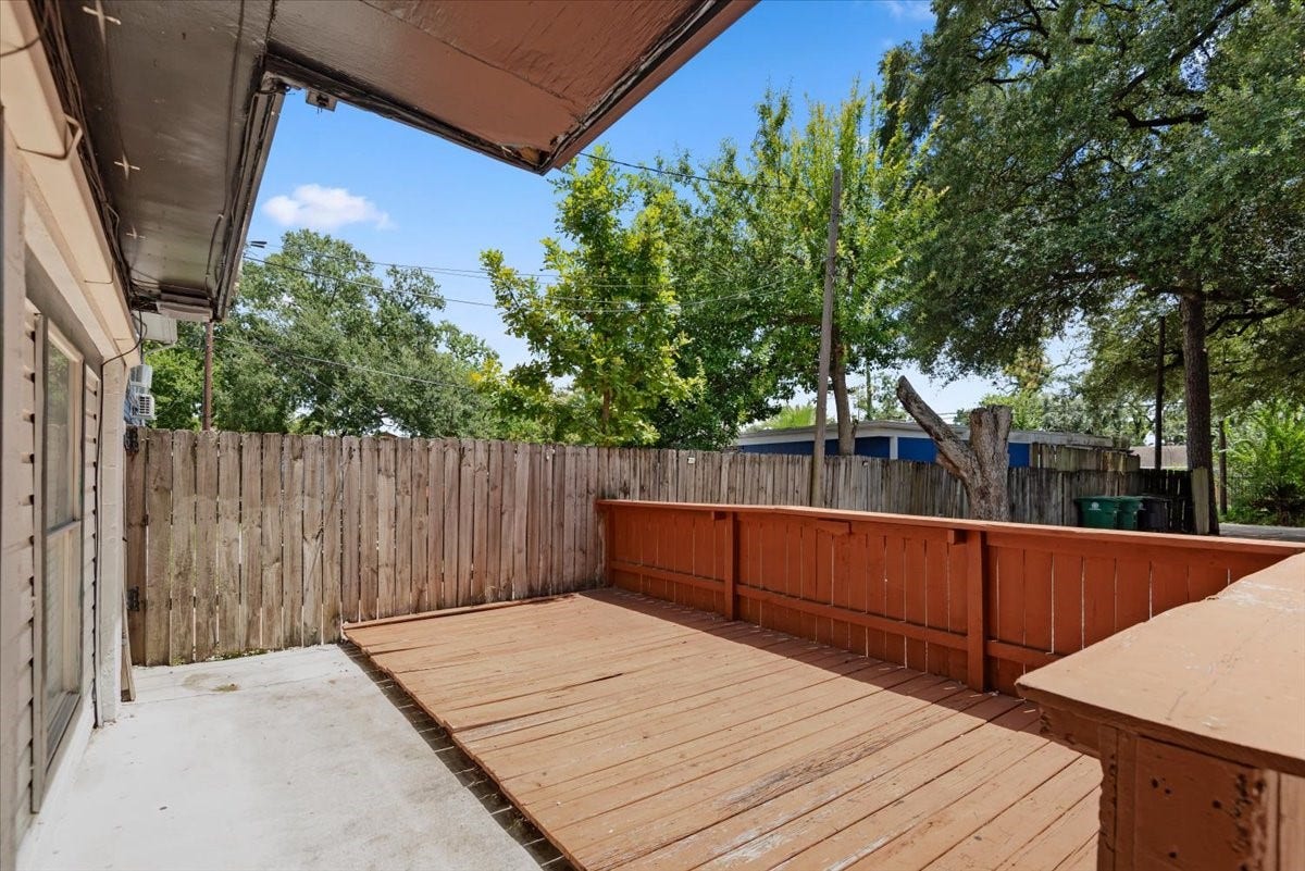 215 Caplin Street, Houston, TX 77022 Private enclosed courtyard with wood deck.