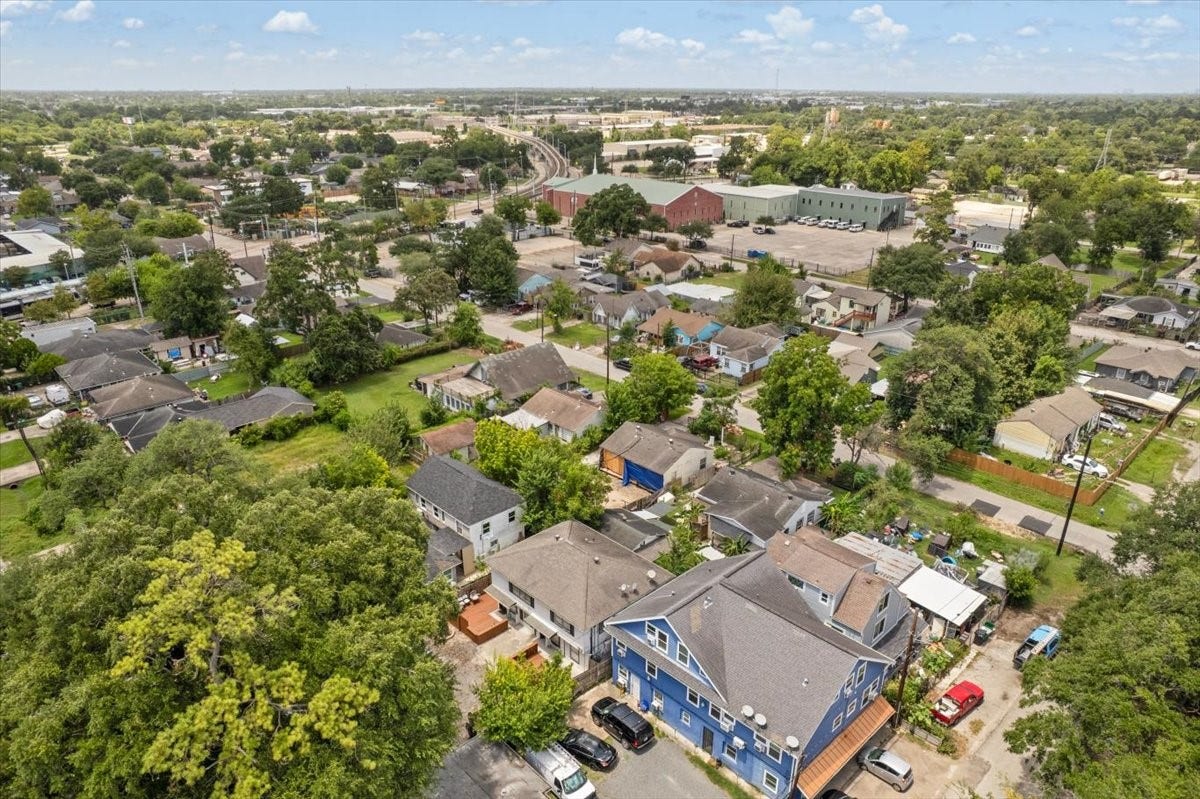 215 Caplin Street, Houston, TX 77022 Aerial view of the property and surrounding neighborhood.