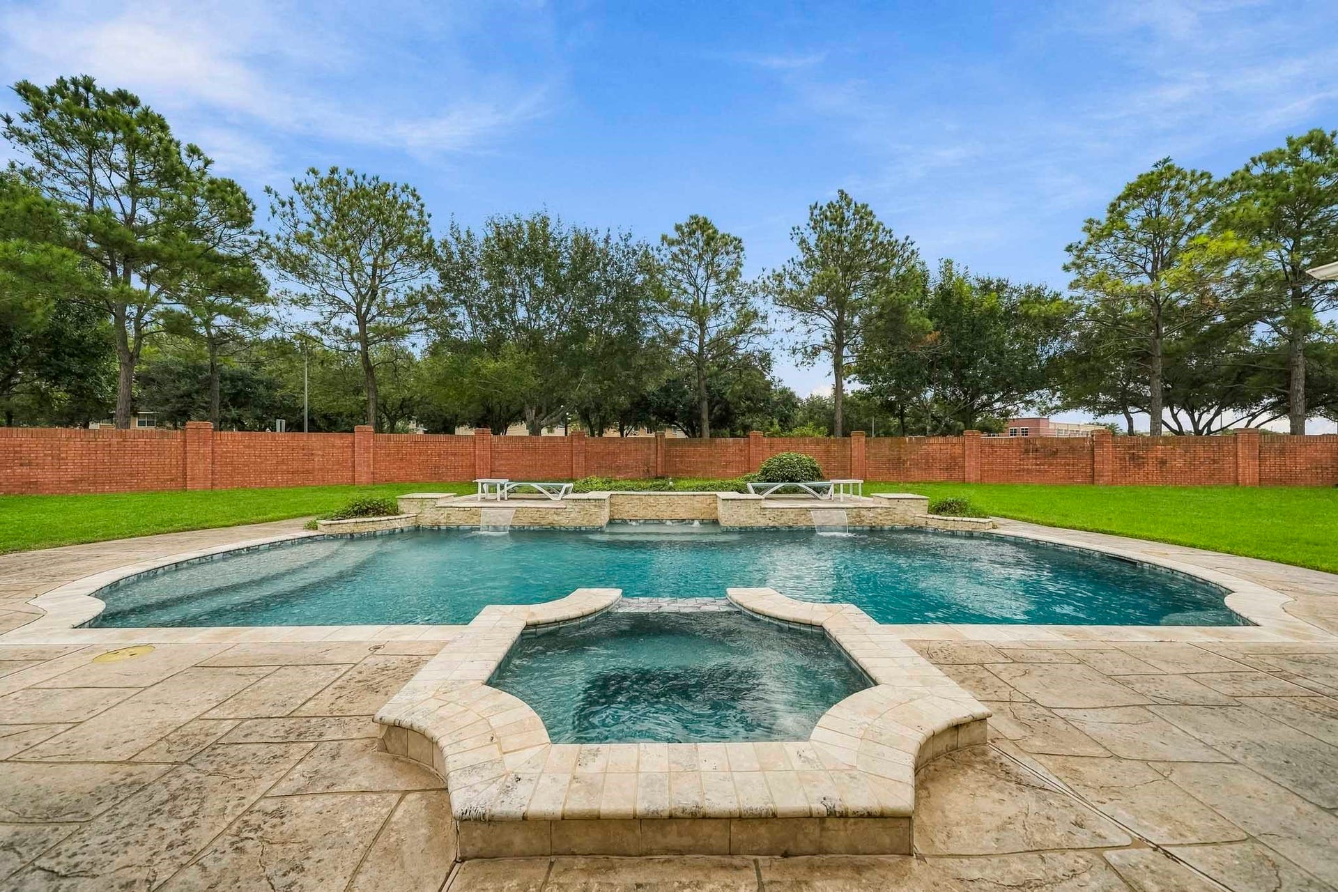 5507 Sandy Trace Court, Katy, TX 77494 Your own private backyard retreat awaits! An expansive pool with an attached spa anchors the beautifully designed outdoor space, surrounded by generous decking and a sprawling lawn. With no rear neighbors, this oversized backyard offers a wonderful sense of openness and privacy.