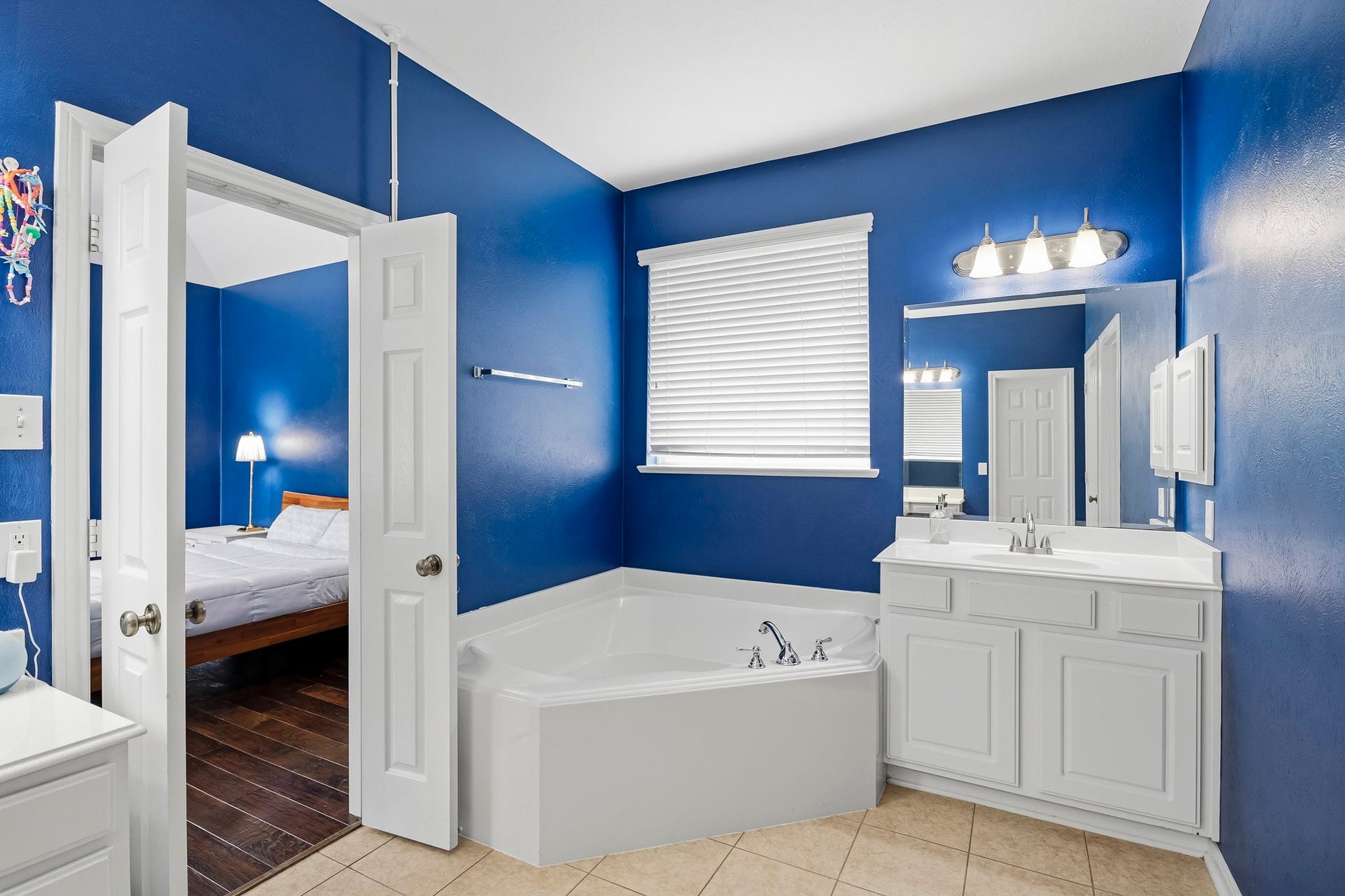 5507 Sandy Trace Court, Katy, TX 77494 Unwind in the comfort of the primary ensuite, where a spacious soaking tub offers a relaxing place to recharge. A nearby window welcomes natural light, while the adjoining vanity and separate shower provide everything needed for a comfortable daily routine.