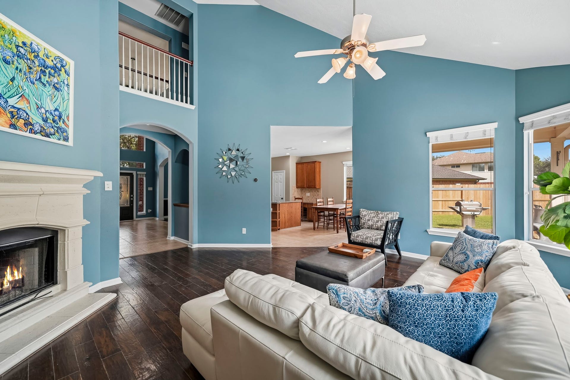 5507 Sandy Trace Court, Katy, TX 77494 From this perspective, the family room's soaring two-story ceiling and expansive dimensions truly shine. The open upper-level design adds architectural interest, while the adjoining kitchen and breakfast area are conveniently accessible, creating a natural connection between the home's main gathering spaces.