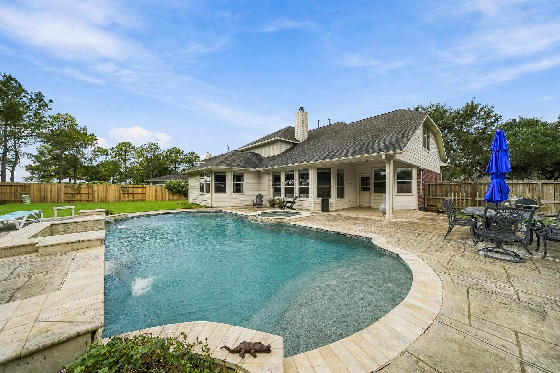 5507 Sandy Trace Court, Katy, TX 77494 Enjoy resort-inspired relaxation right in your own backyard! The beautiful in-ground pool features graceful curved edges and an attached spa, surrounded by expansive decking with ample space for lounge chairs and outdoor furnishings.