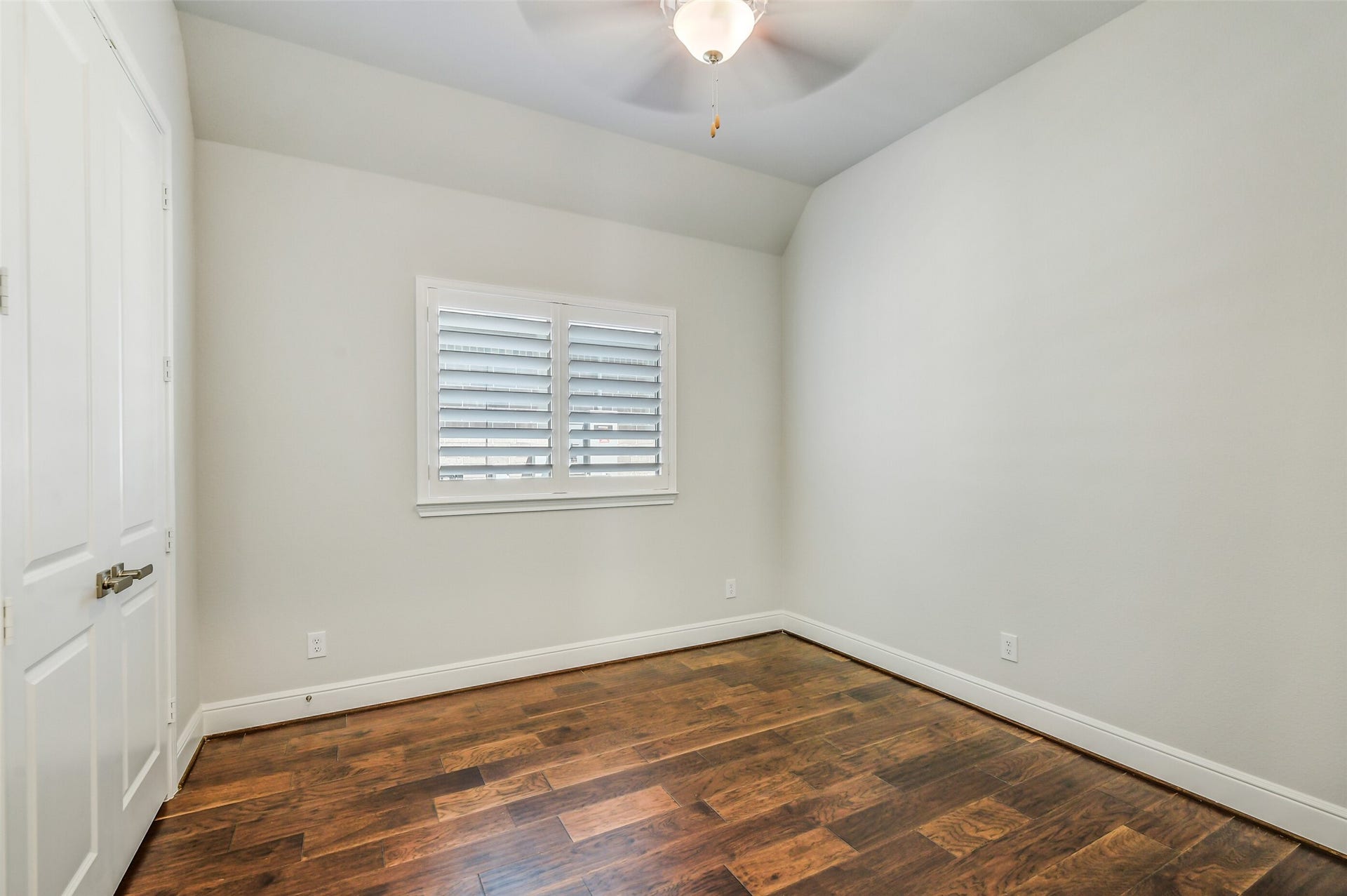 Bedroom two also has the Wood floors and plantation shutters on the window.  It is located next to the second bathroom.