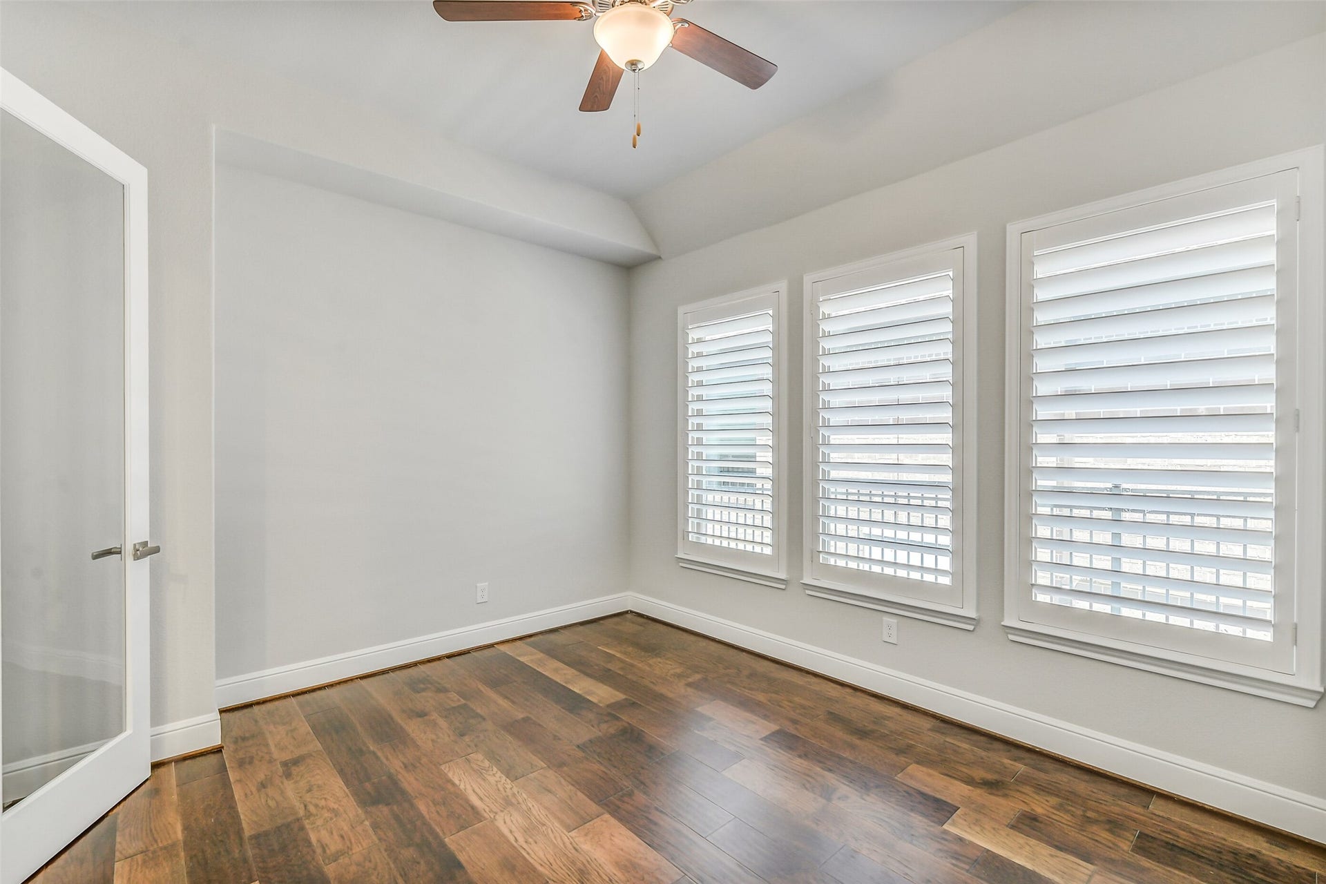 Moving down the hall is the study with glass French doors.  It is far enough removed from the kitchen and living area to offer privacy.
