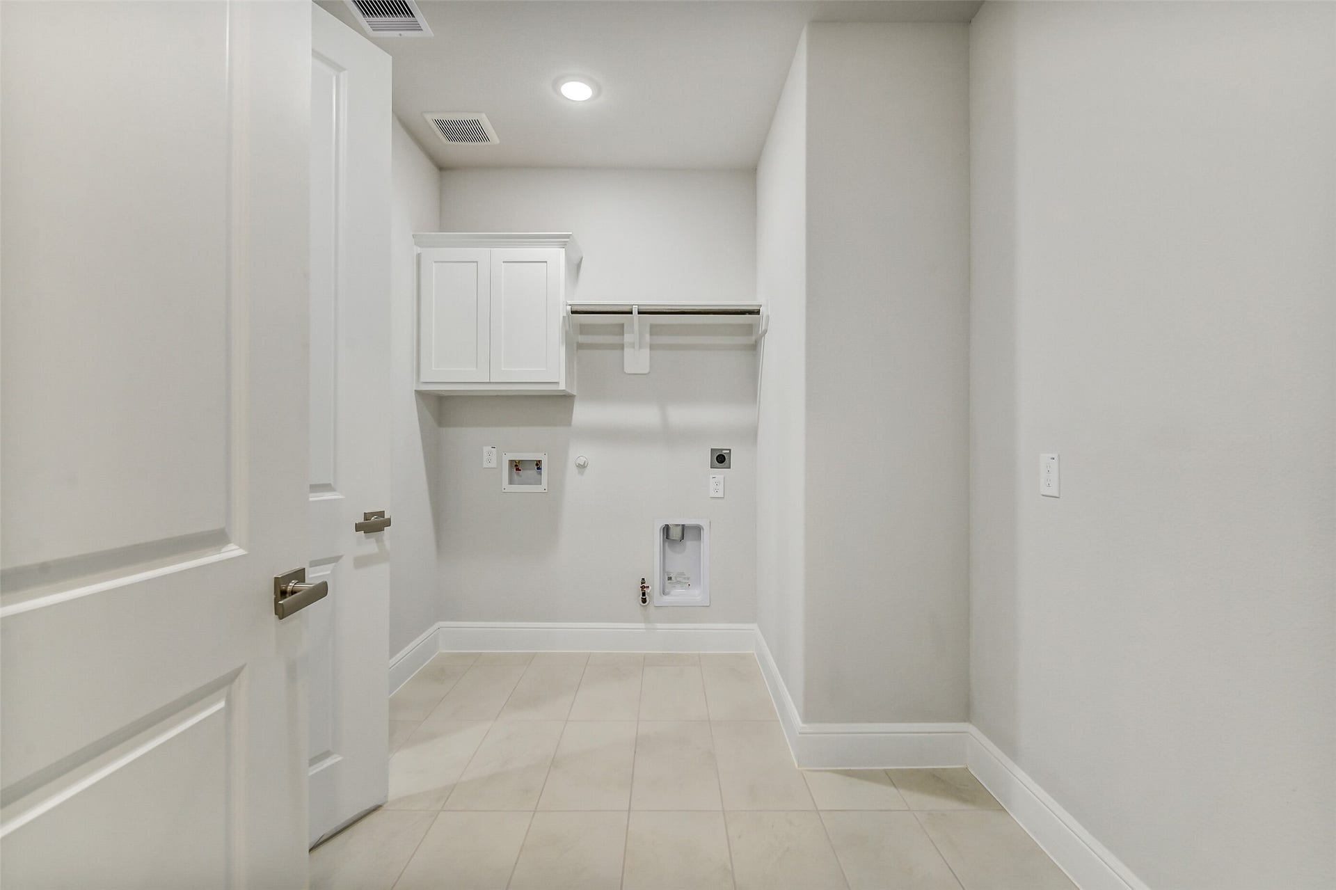 The large laundry room offers the choice of gas or electric dryer hook up.  There is also room for an extra refrigerator or build in a place to use to fold your clothes.