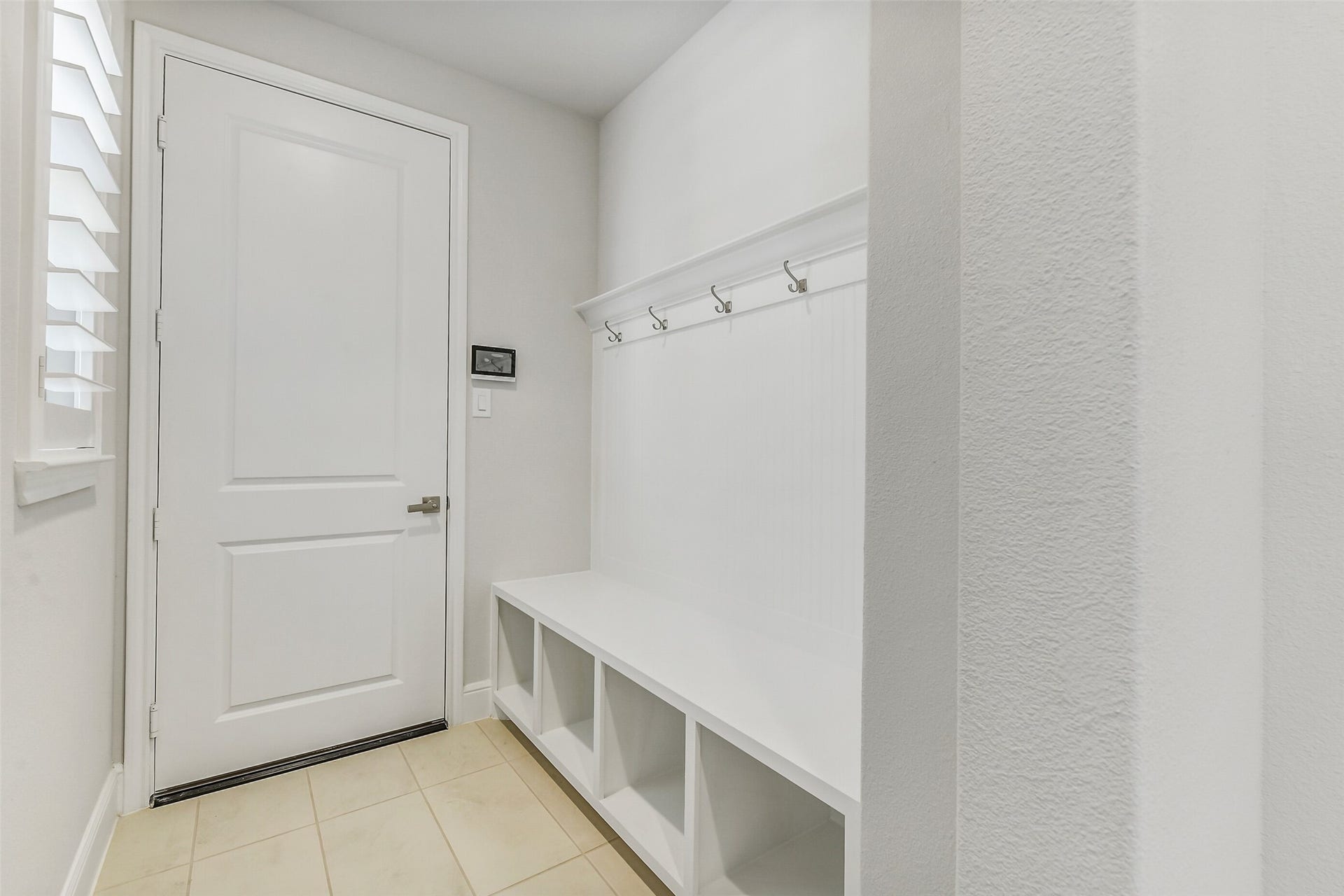 Entering from the garage is an ultra efficient Mud room with storage space and hooks for coats and hats.