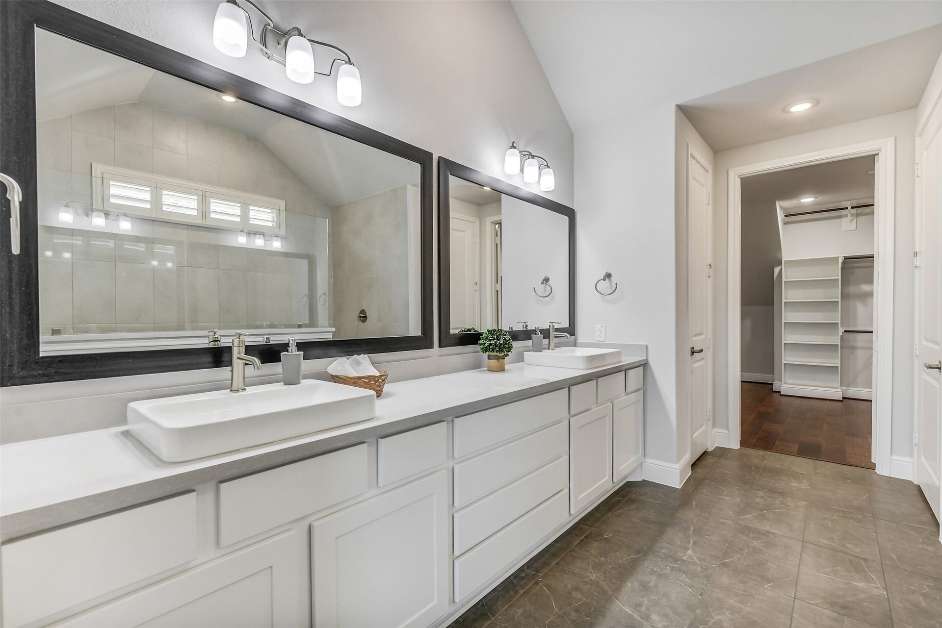Vanity area has both drawers and cabinets for storage.