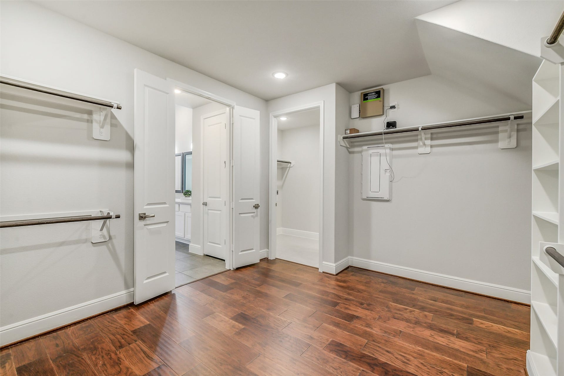 In addition to being large and well planned for storage the closet opens to the utility room, making the chore of putting away the clean clothes so easy.