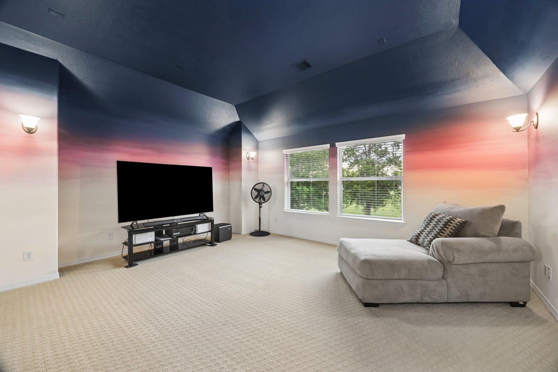 24935 Waterstone Estates Circle W, Tomball, TX 77375 A generously sized upstairs media room wired for projector and surround sound offers a versatile space for entertainment and relaxation.