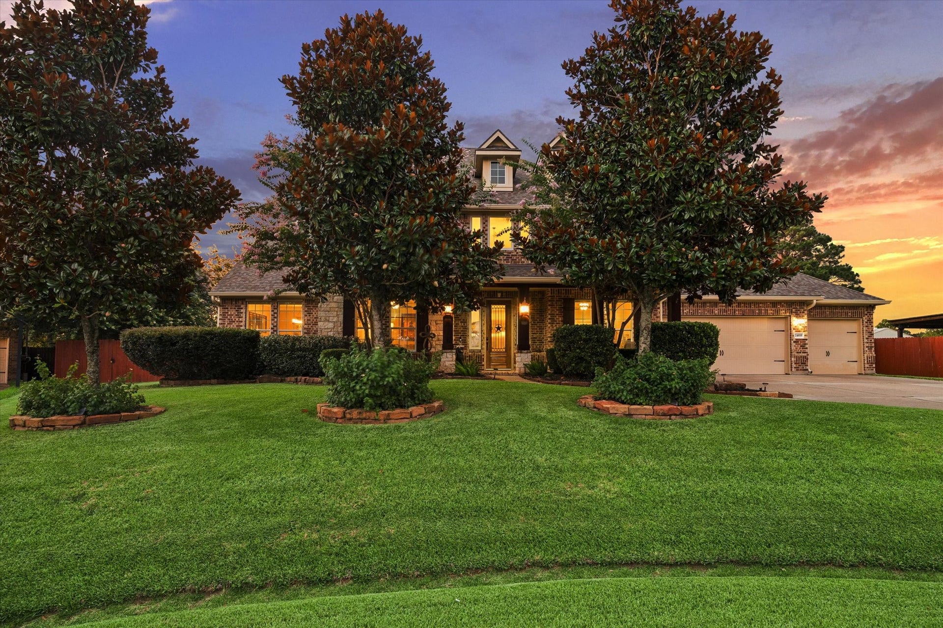 24935 Waterstone Estates Circle W, Tomball, TX 77375 A captivating first impression of this exceptional 5,783-square-foot residence, where timeless architecture, mature landscaping, and lush surroundings come together to create a warm and elegant welcome.