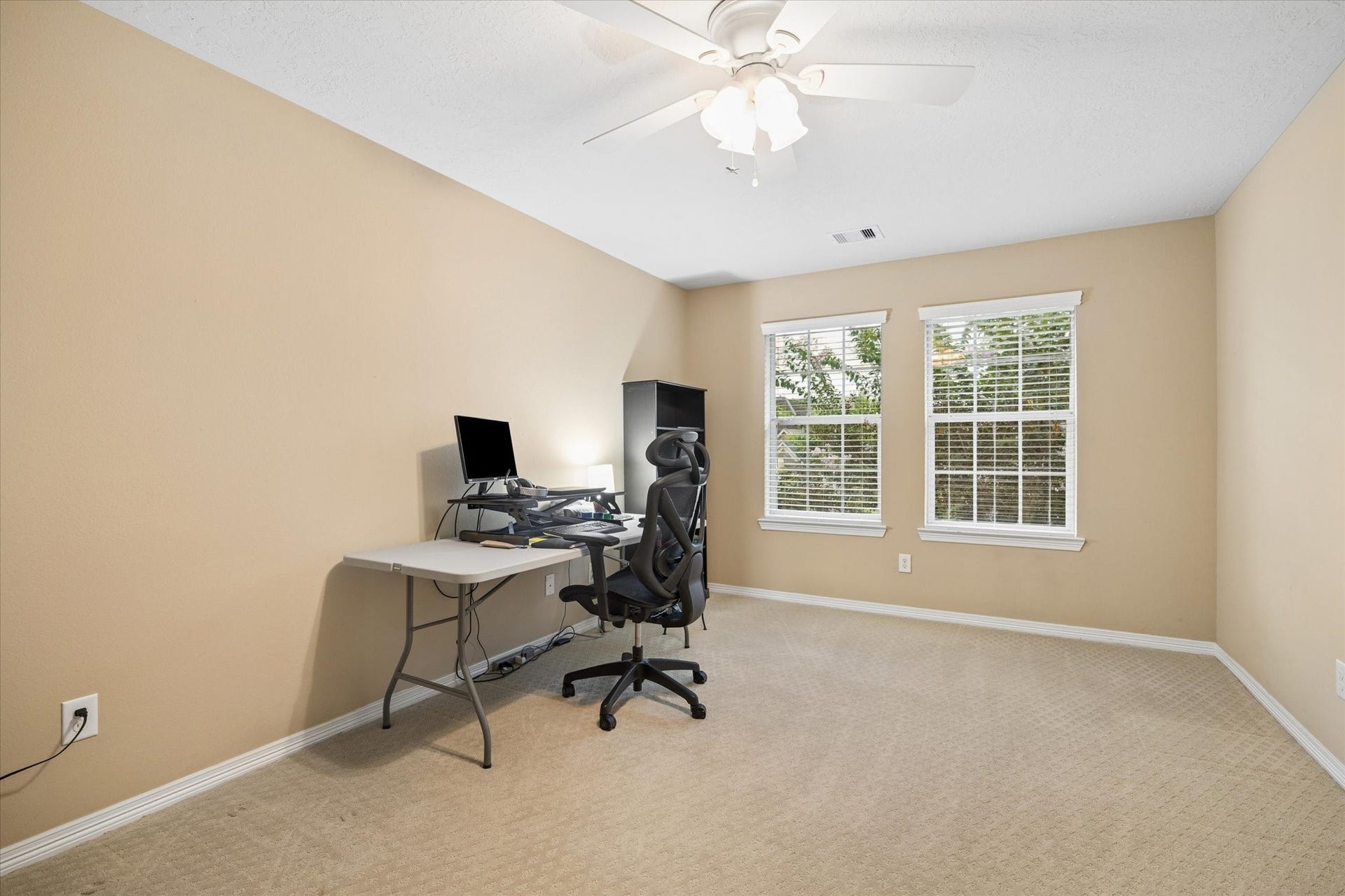 24935 Waterstone Estates Circle W, Tomball, TX 77375 Another inviting secondary bedroom filled with natural light and offering a generous layout, creating a comfortable and welcoming retreat for family or guests.