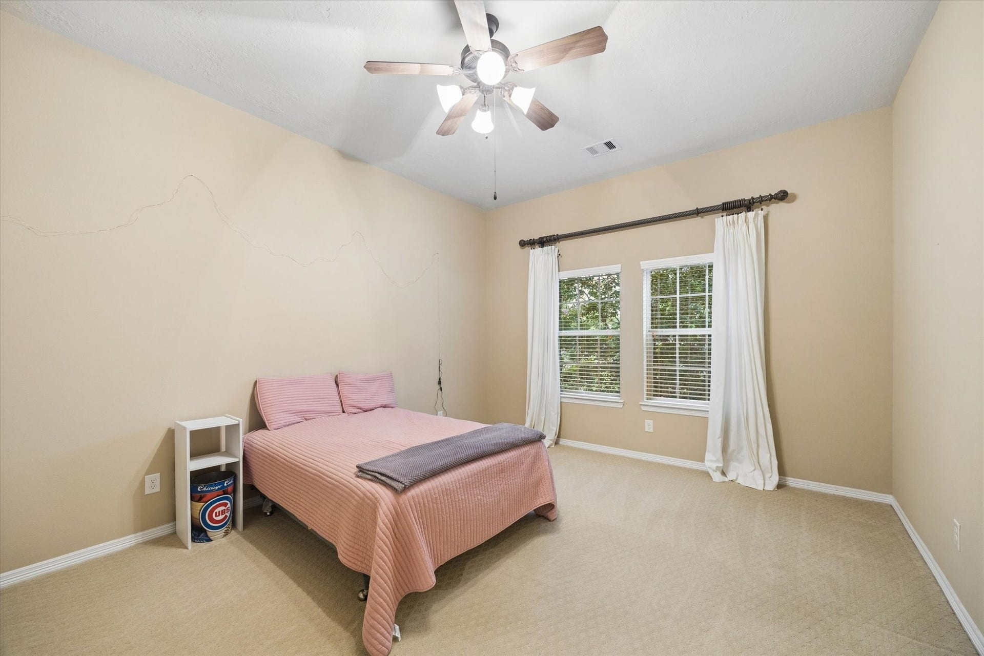 24935 Waterstone Estates Circle W, Tomball, TX 77375 Inviting secondary bedroom offering a comfortable layout, high ceilings, and an abundance of natural light.