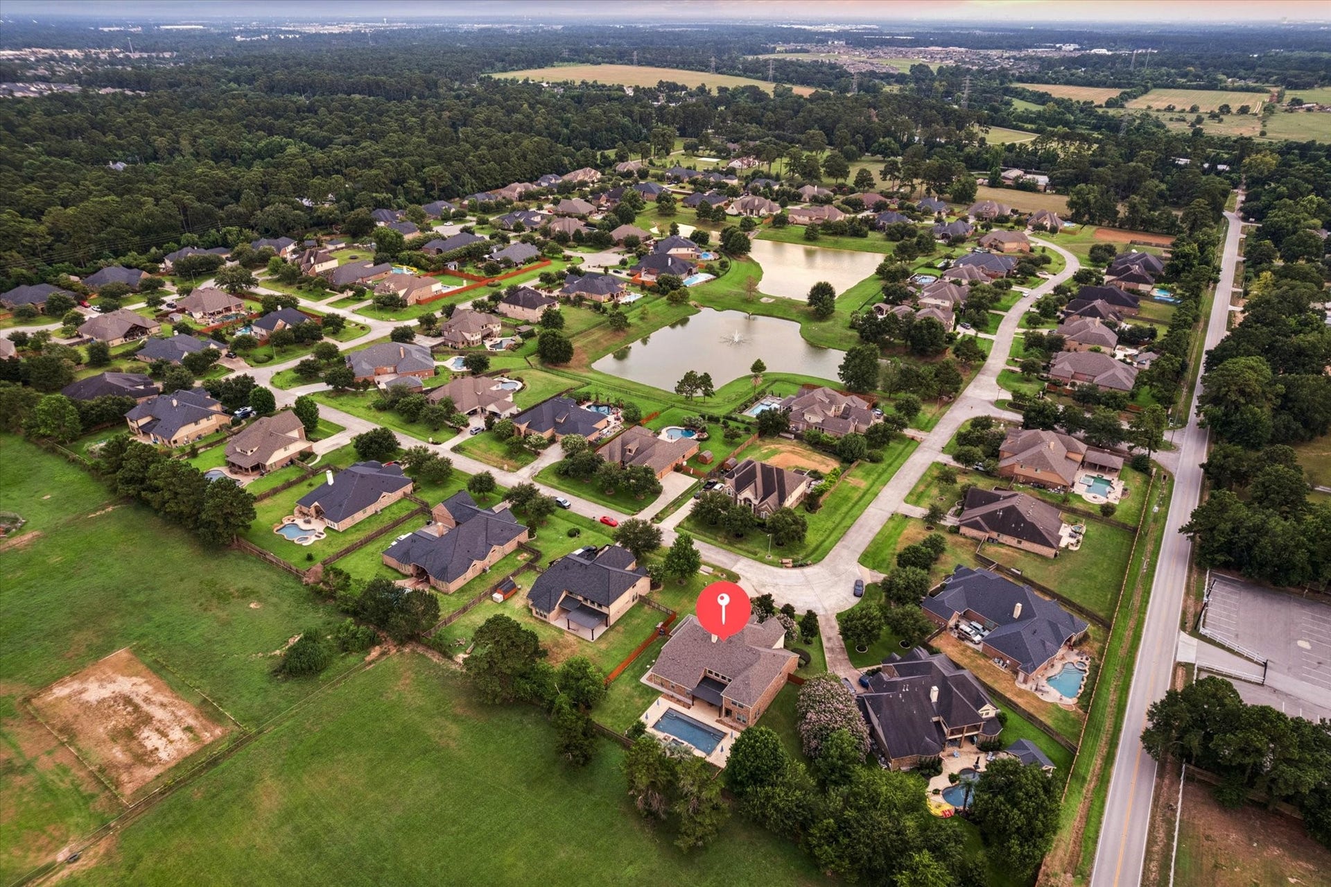 24935 Waterstone Estates Circle W, Tomball, TX 77375 This impressive aerial view highlights the propertys desirable cul-de-sac location and expansive backyard, offering exceptional space for outdoor living and entertaining. The resort-style pool and beautifully designed backyard create a private retreat, while the nearby community lake, just a short walk from the home, adds to the peaceful and relaxing atmosphere of Waterstone Estates.