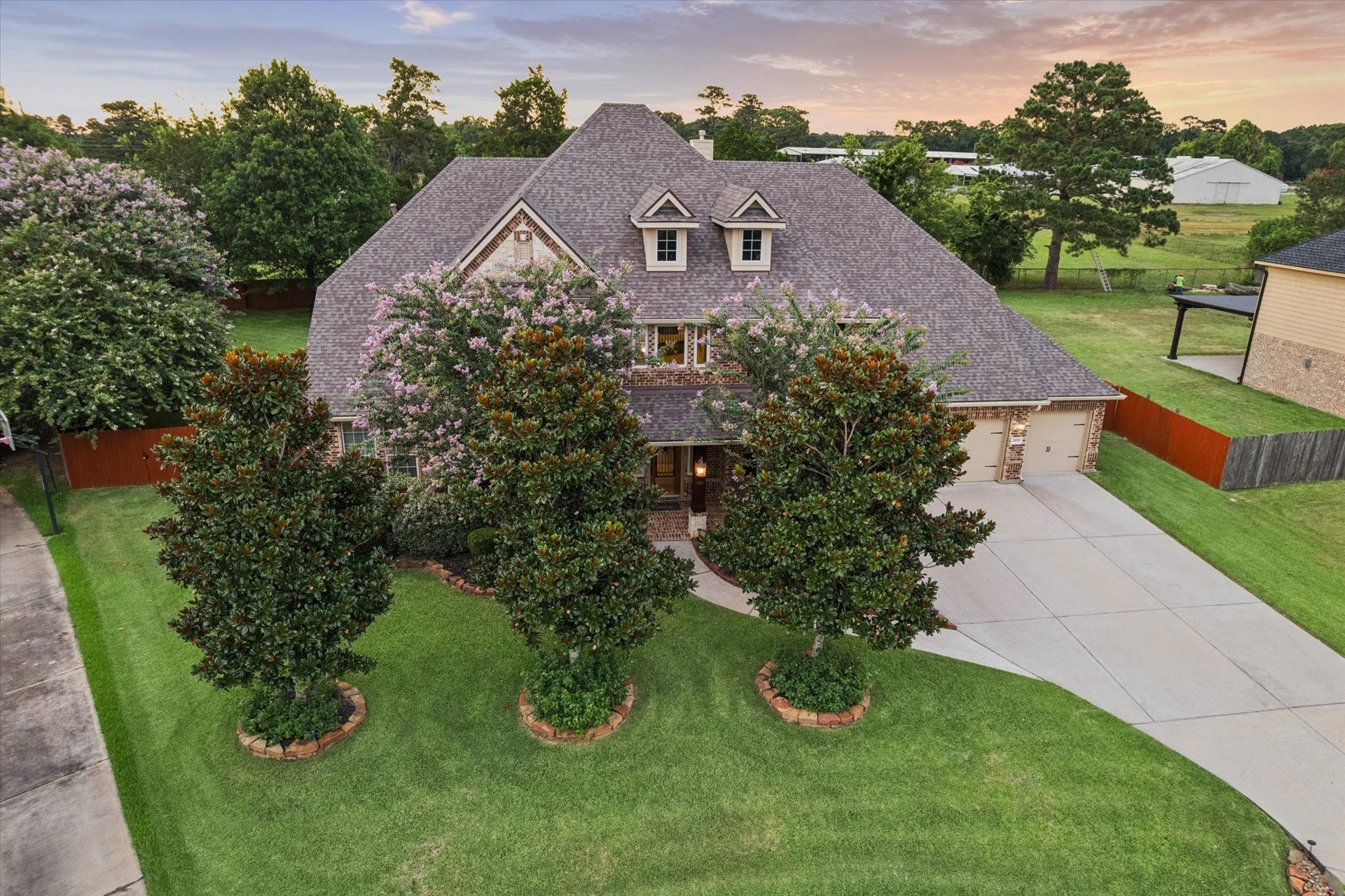 24935 Waterstone Estates Circle W, Tomball, TX 77375 This impressive aerial view highlights the homes desirable location within the beautiful Waterstone Estates community. Surrounded by spacious homesites, scenic lakes, and peaceful surroundings, this exceptional property offers the perfect setting to enjoy the lifestyle and charm of this sought-after community.