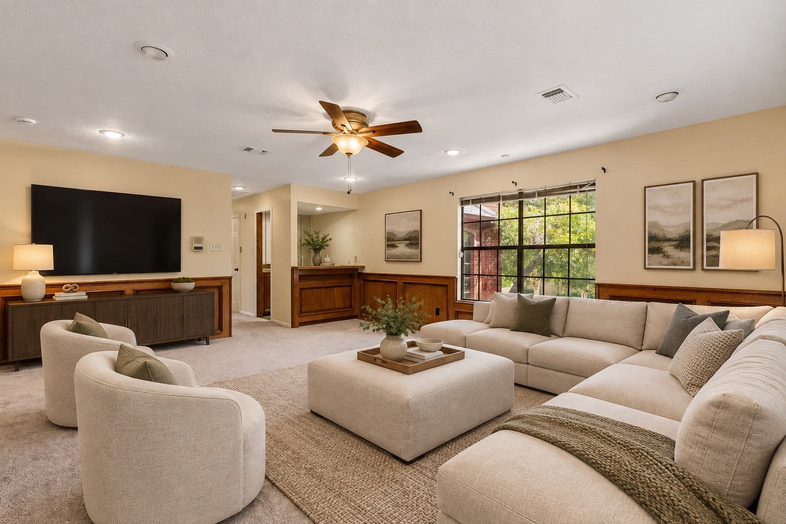 Virtually Staged: An ideal space for relaxation and entertainment! Features a built-in wet bar, rich wainscoting, plush carpeting, and flexible square footage easily styled as a media lounge.