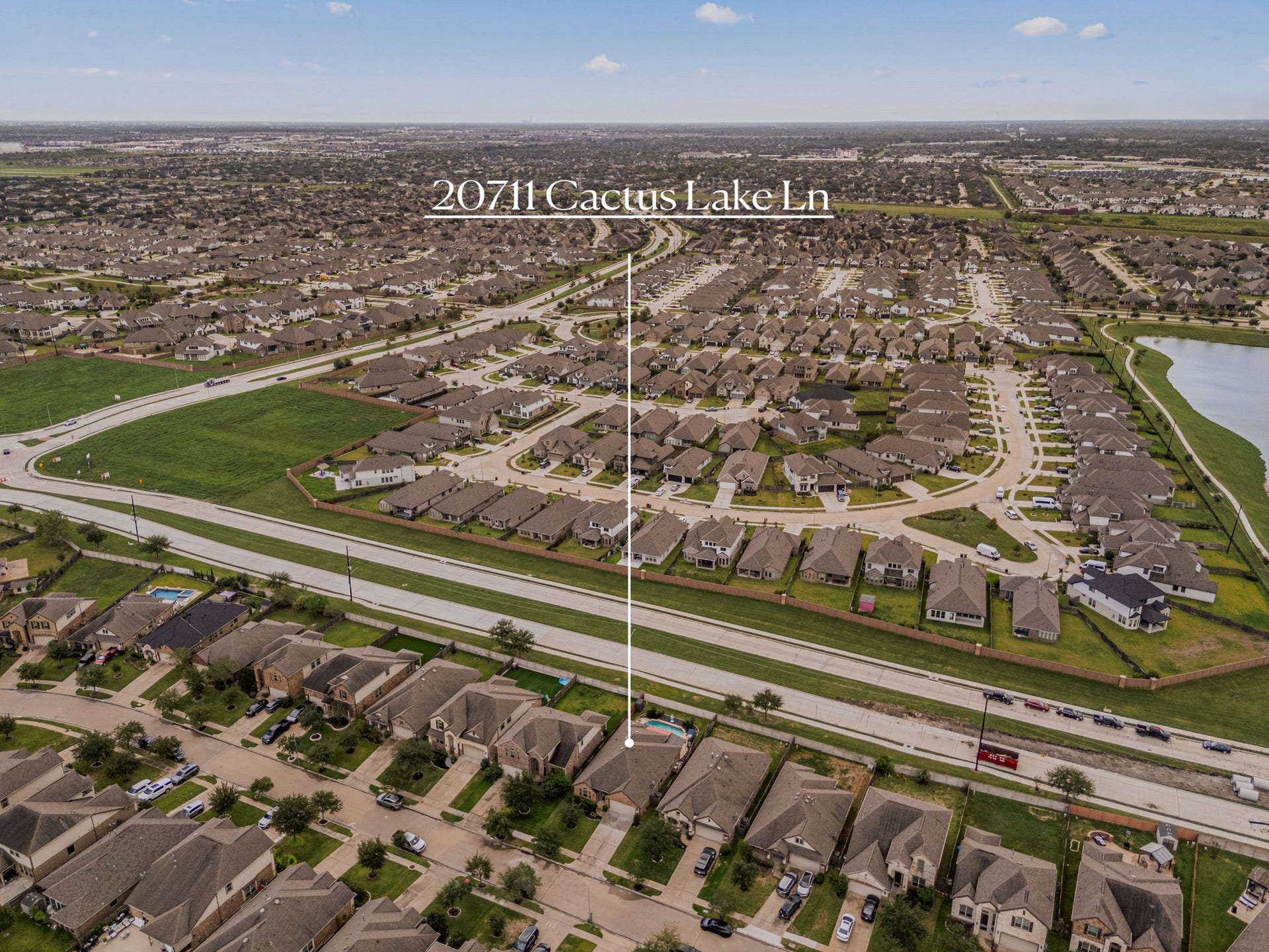 Aerial view highlighting the ideal location of 20711 Cactus Lake Lanebacked by a wide green buffer zone with no back neighbors for maximum privacy!
