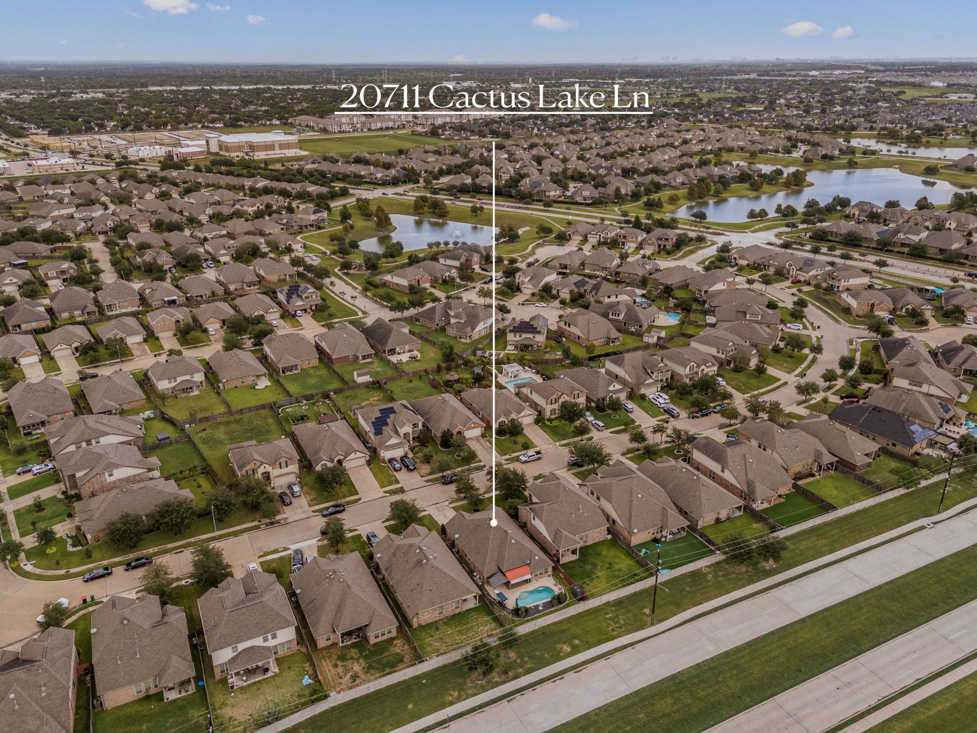 This aerial overview highlights 20711 Cactus Lake Lane's fantastic proximity to the neighborhood's scenic lakes, fountains, and interconnected walking trails just moments from your front door.