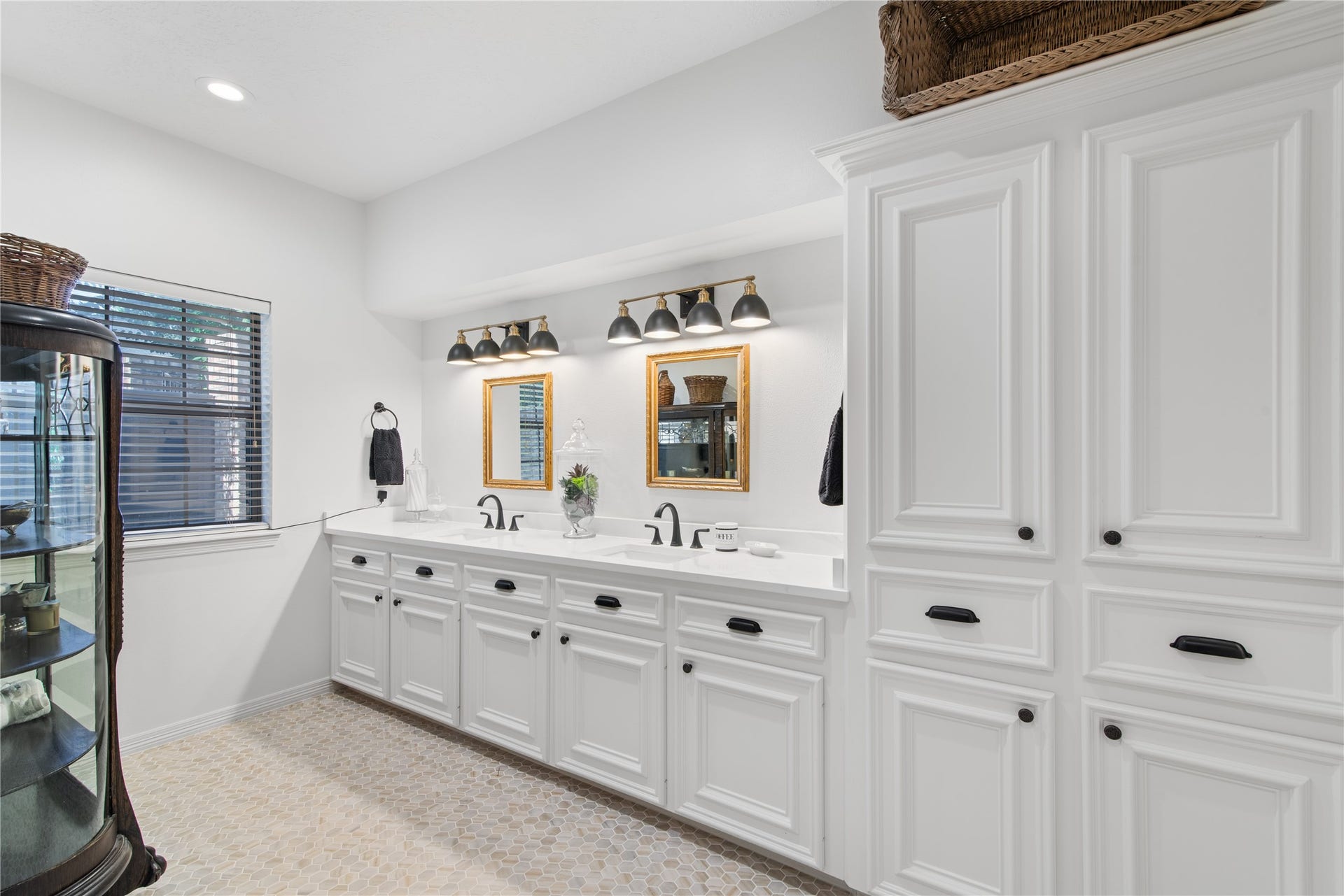 901 Longmire Road, #51, Conroe, TX 77304 Spacious primary bathroom featuring an elegant dual-sink vanity, beautiful cabinetry, stylish lighting & generous storage, blending timeless elegance with everyday comfort.