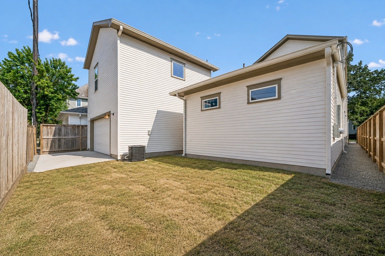 Spacious green space with room for a future pool, outdoor entertaining, or a place for kids and pets to play.