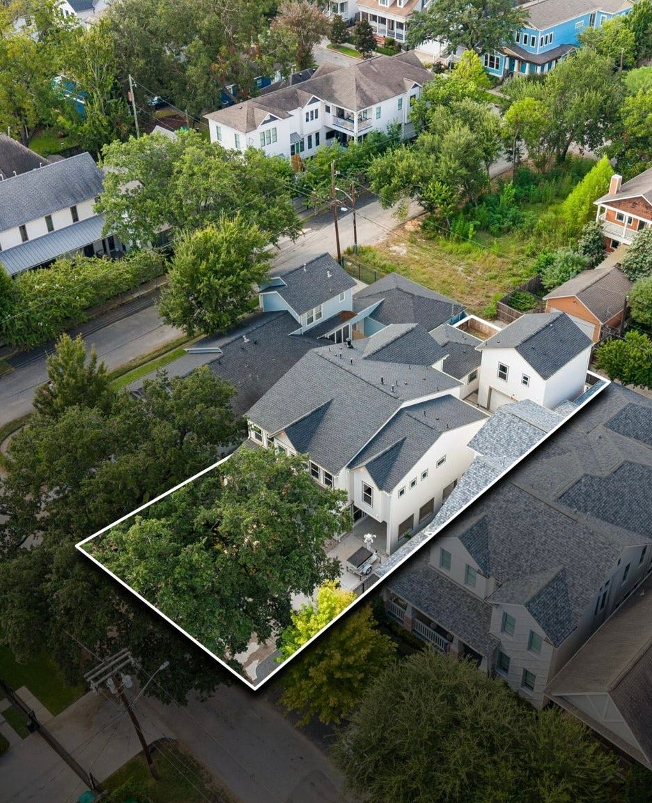 Aerial view showcasing the beautiful mature shade tree and private apartment situated above the detached garage.