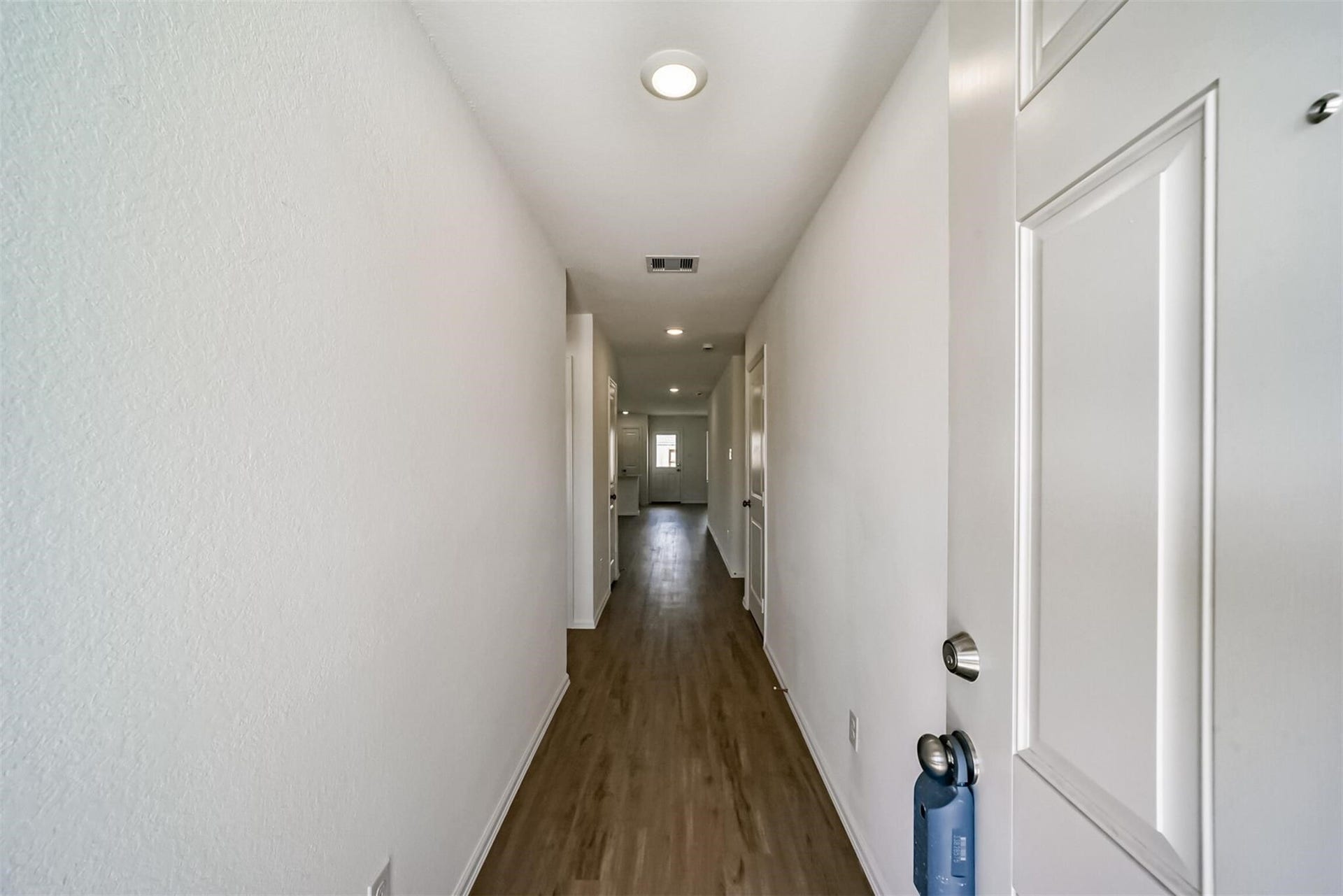 Spacious foyer and hallway leading into the main living areas