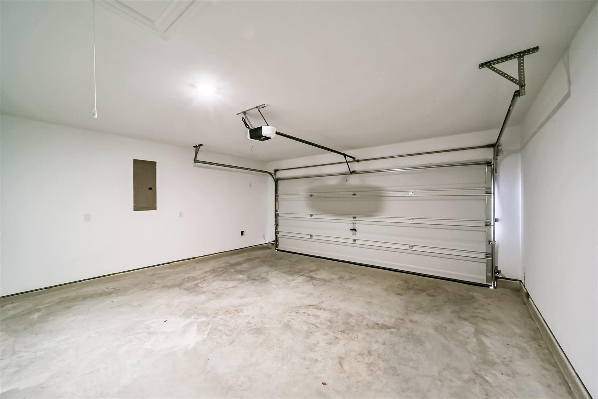 Great sized two-car garage offering plenty of parking and storage space, equipped with an automatic garage door opener