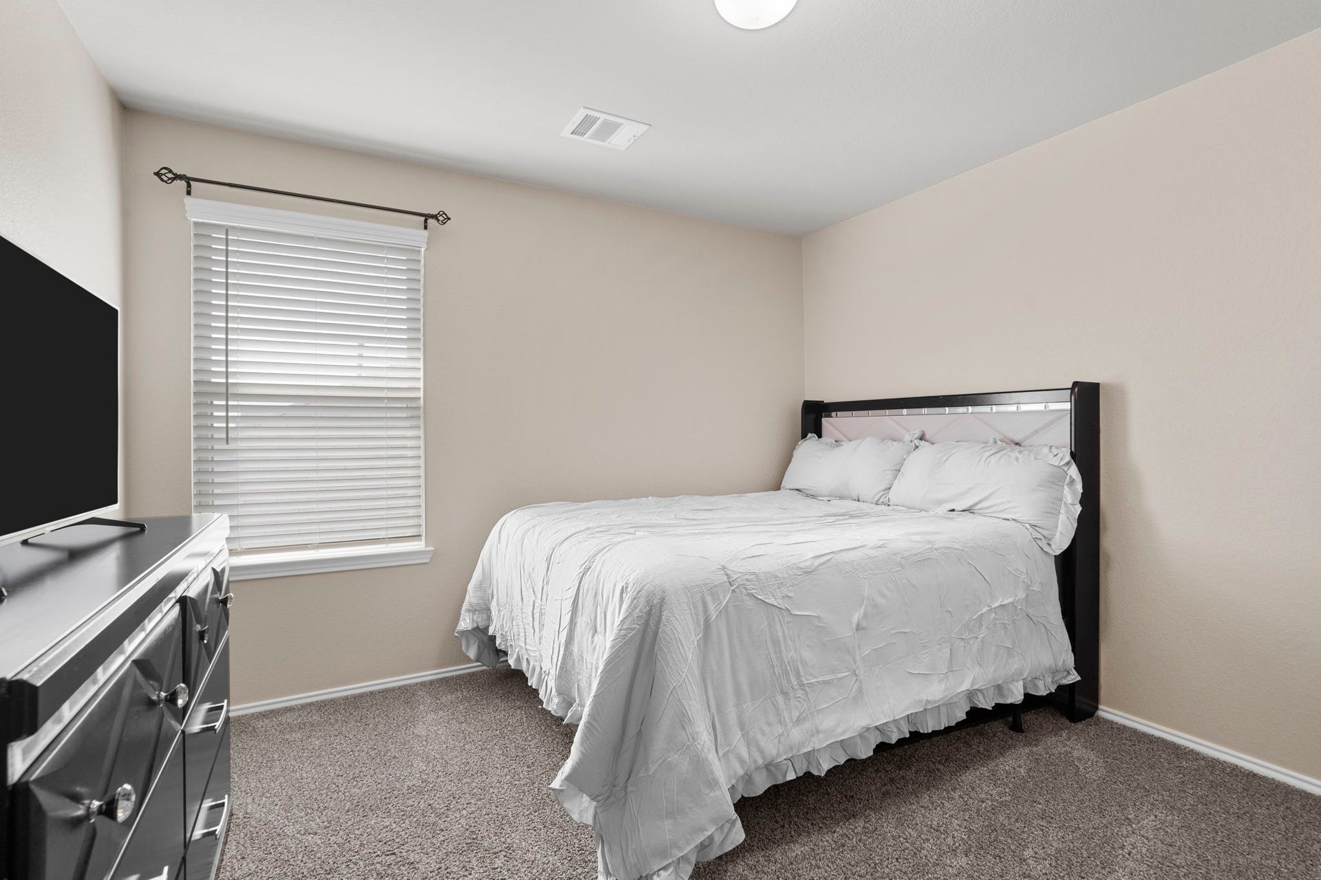 22624 Theodoli Drive, Katy, TX 77449 Upstairs Bedroom 2: A bright and inviting space, perfect for family or guests.