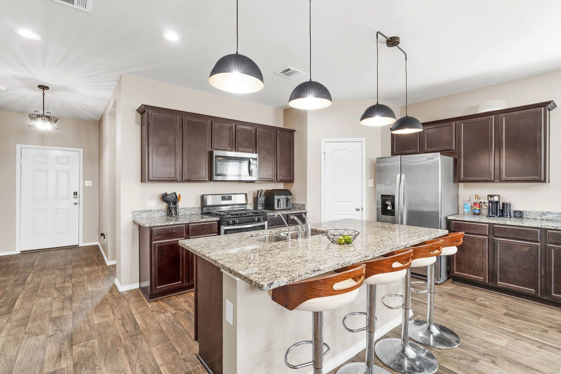 22624 Theodoli Drive, Katy, TX 77449 The kitchen island includes a convenient seating area, perfect for casual meals, conversation, or keeping the cook company.