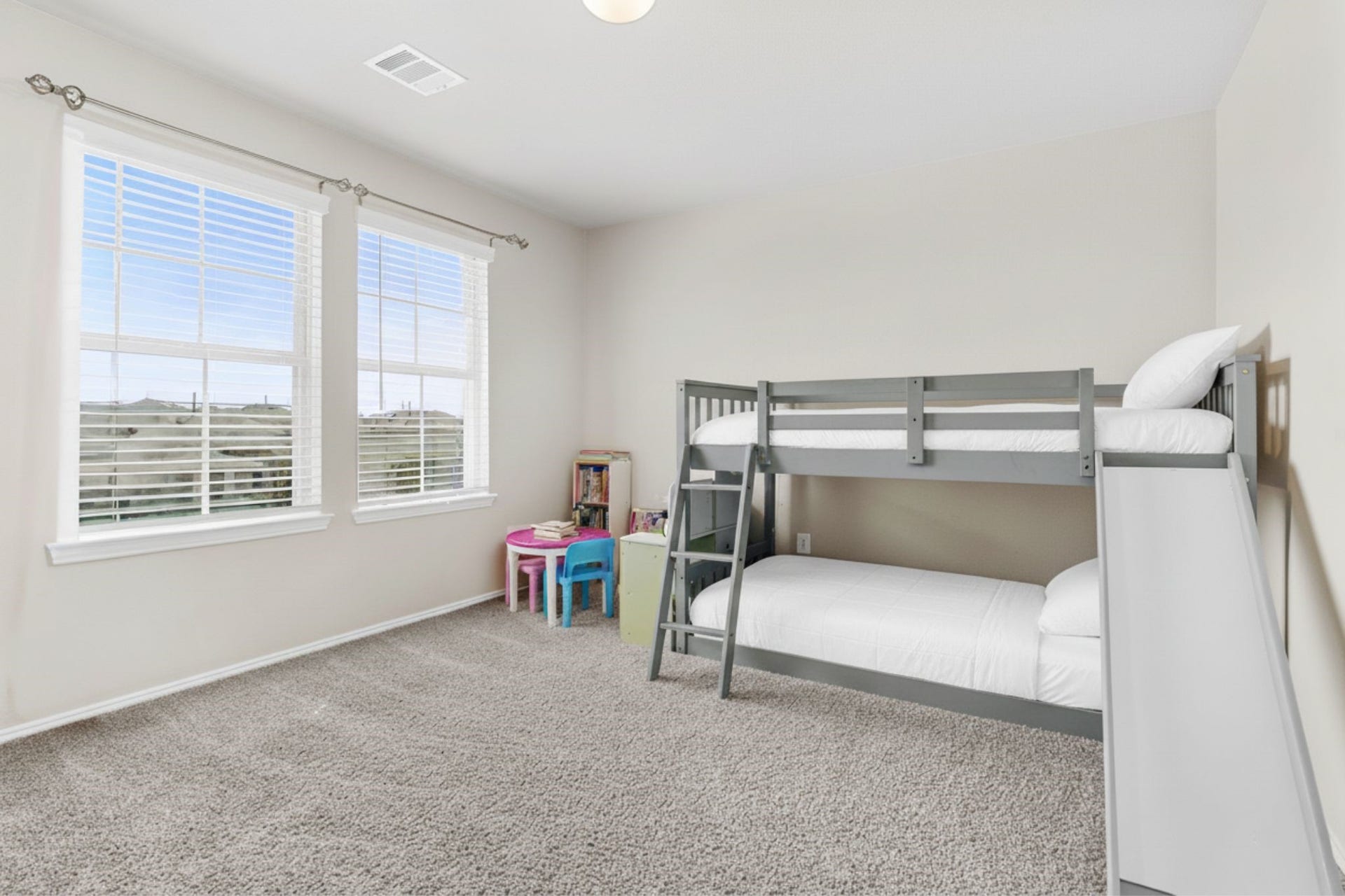 22624 Theodoli Drive, Katy, TX 77449 Upstairs Bedroom 1: Spacious and fun, ideal for a childs bedroom or play area.