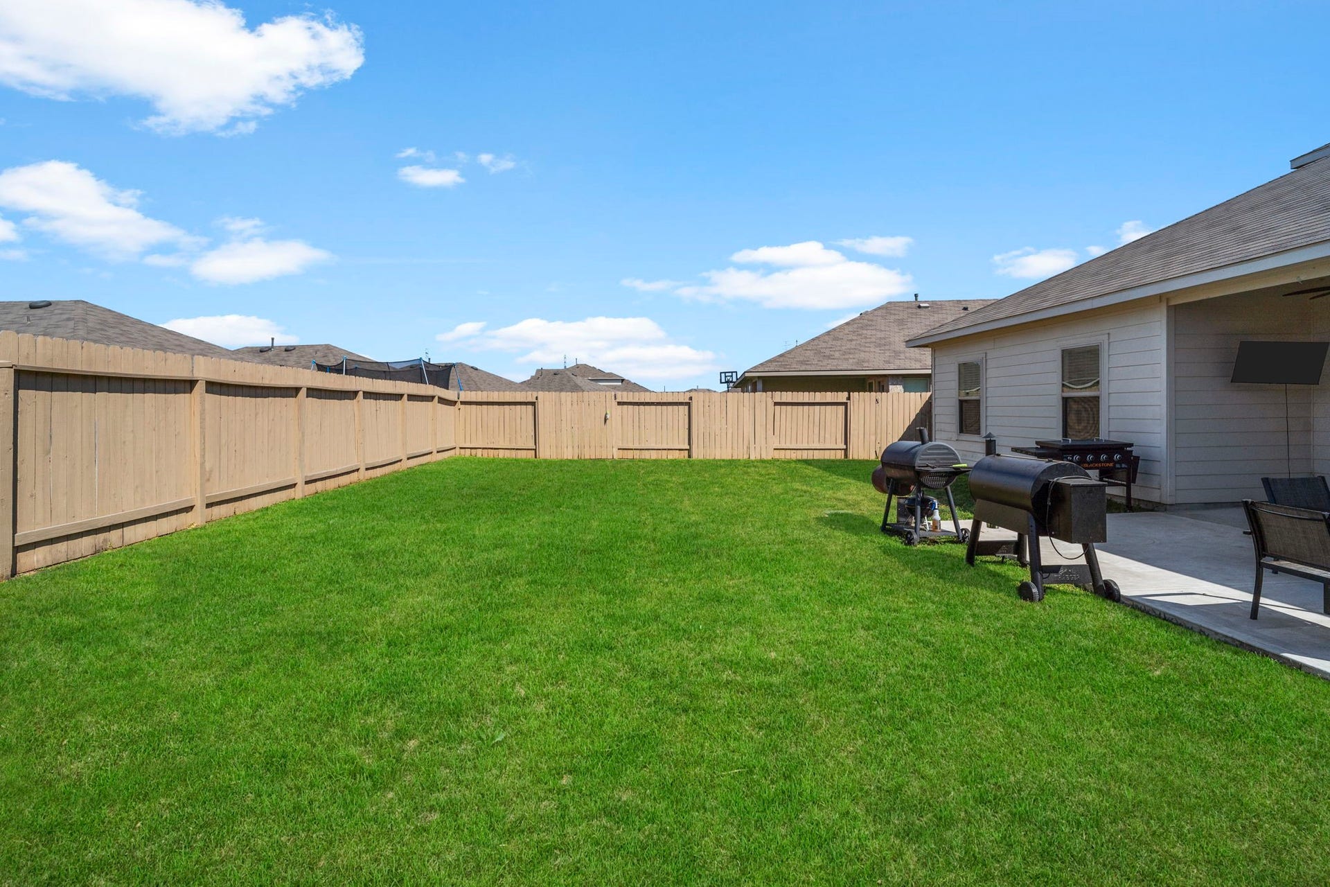 22624 Theodoli Drive, Katy, TX 77449 Fully fenced and full of possibilities, the spacious backyard features an extended patio, ideal for grilling, entertaining, or enjoying time with family and friends.