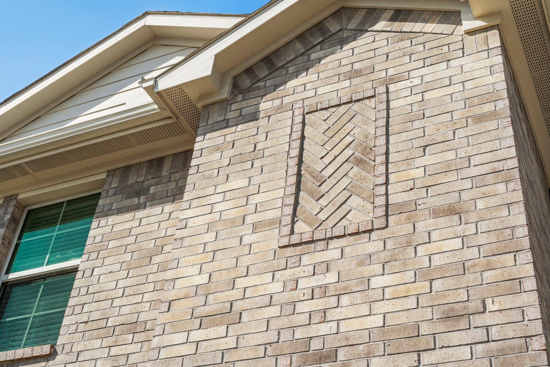 22624 Theodoli Drive, Katy, TX 77449 The brick features a distinctive design, adding character and visual interest to the home's exterior.