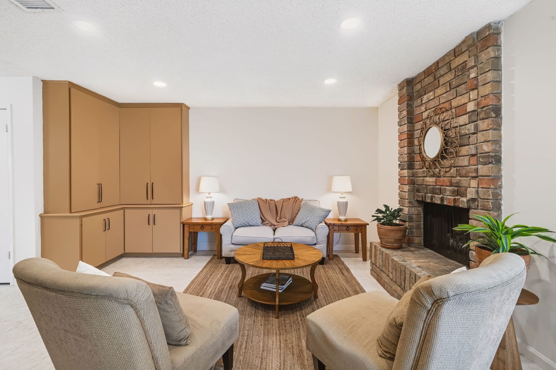 1802 Brushy Creek Drive, Sugar Land, TX 77478 Built-in storage cabinetry maintains a clean, uncluttered feel in the family room.