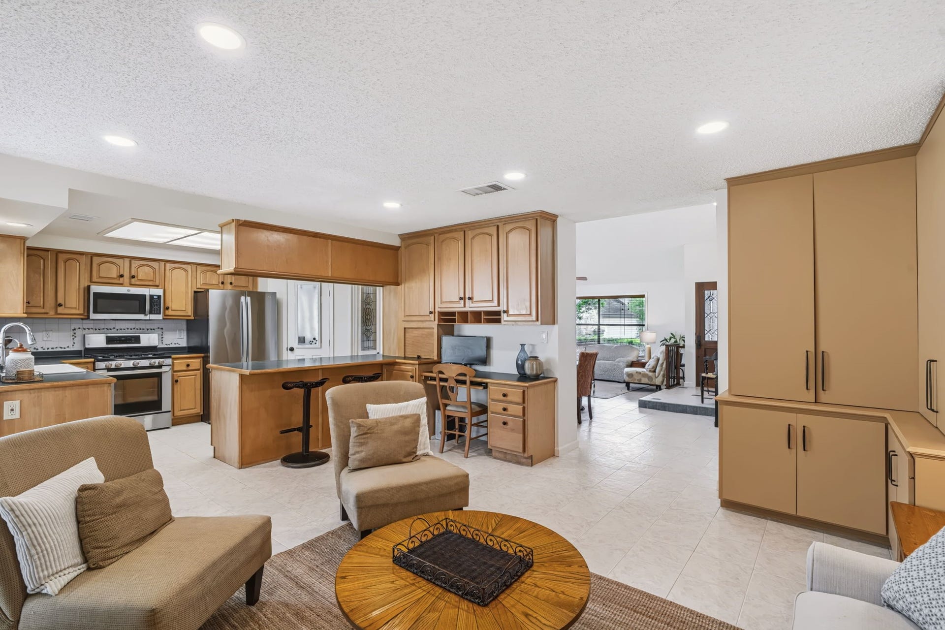 1802 Brushy Creek Drive, Sugar Land, TX 77478 The family room flows seamlessly into the living and dining rooms.