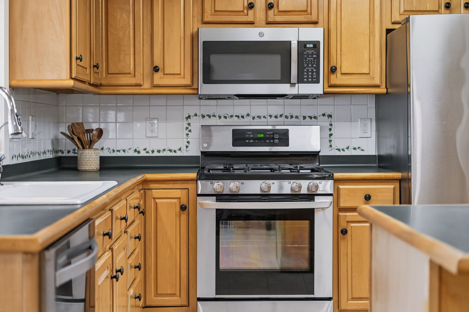 1802 Brushy Creek Drive, Sugar Land, TX 77478 Well-maintained stainless steel appliances include a gas range, dishwasher, and a built-in microwave updated in 2025.