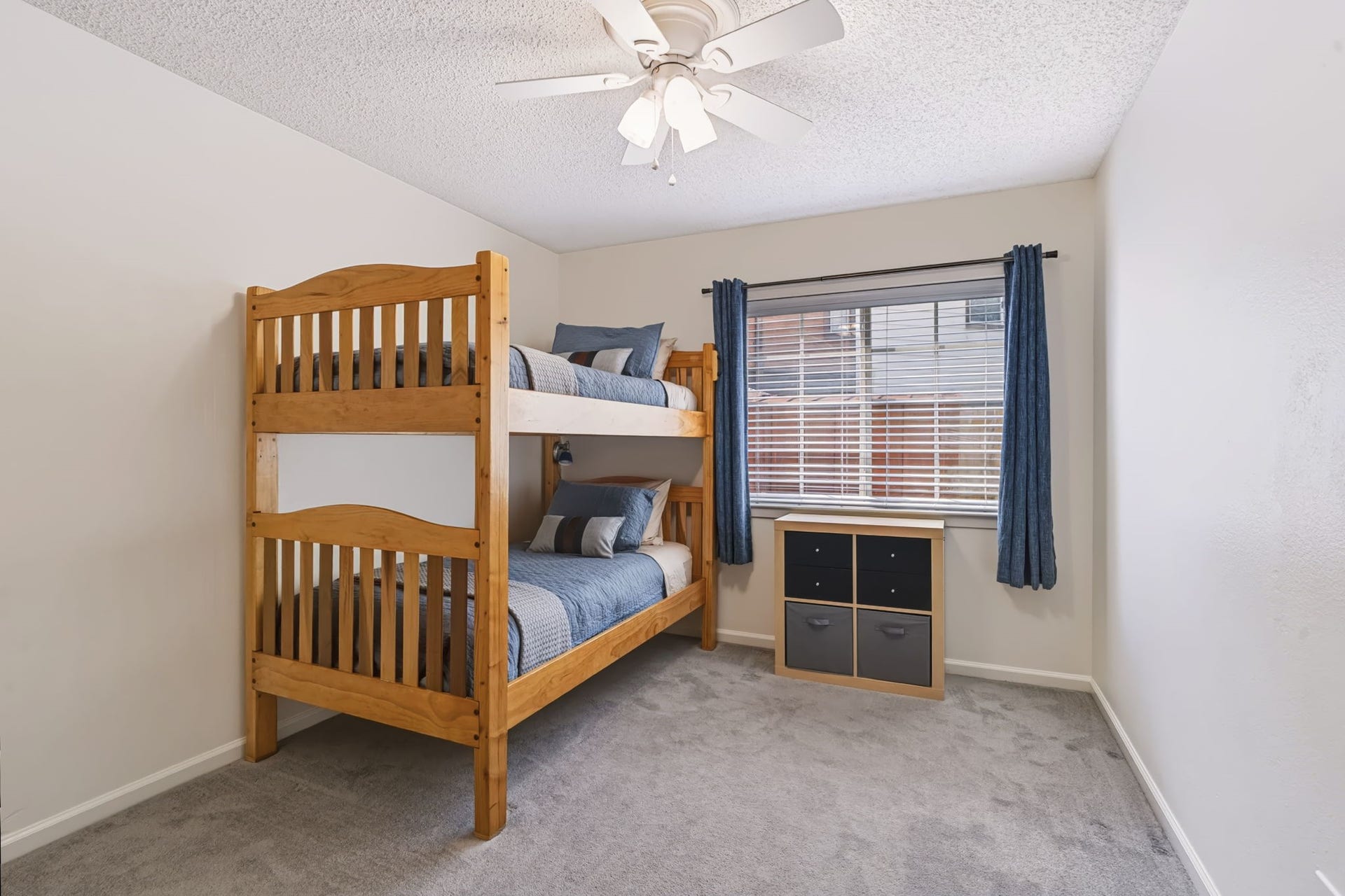 1802 Brushy Creek Drive, Sugar Land, TX 77478 This bedroom features neutral-toned carpeting, a large window, and a double-door closet offering plenty of storage.