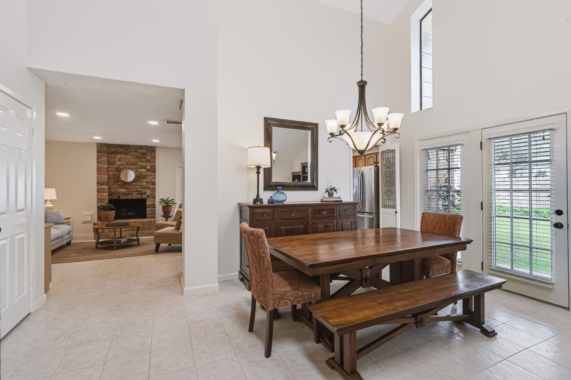 1802 Brushy Creek Drive, Sugar Land, TX 77478 A French door with sidelight opens from the dining room to a side patio, creating a connection to the outdoors and an ideal spot for enjoying fresh air or extending your entertaining space.