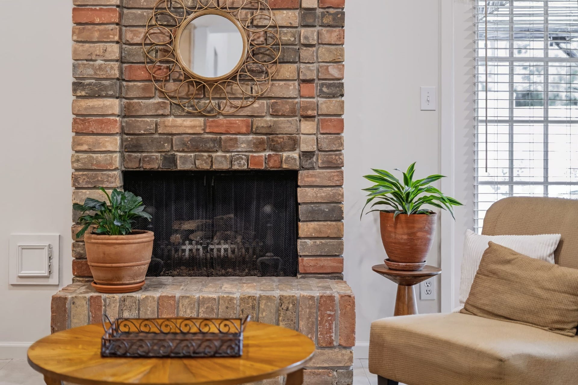 1802 Brushy Creek Drive, Sugar Land, TX 77478 A heartwarming, gas-log brick fireplace creates a cozy focal point, perfect for relaxing evenings and gathering with family and friends.
