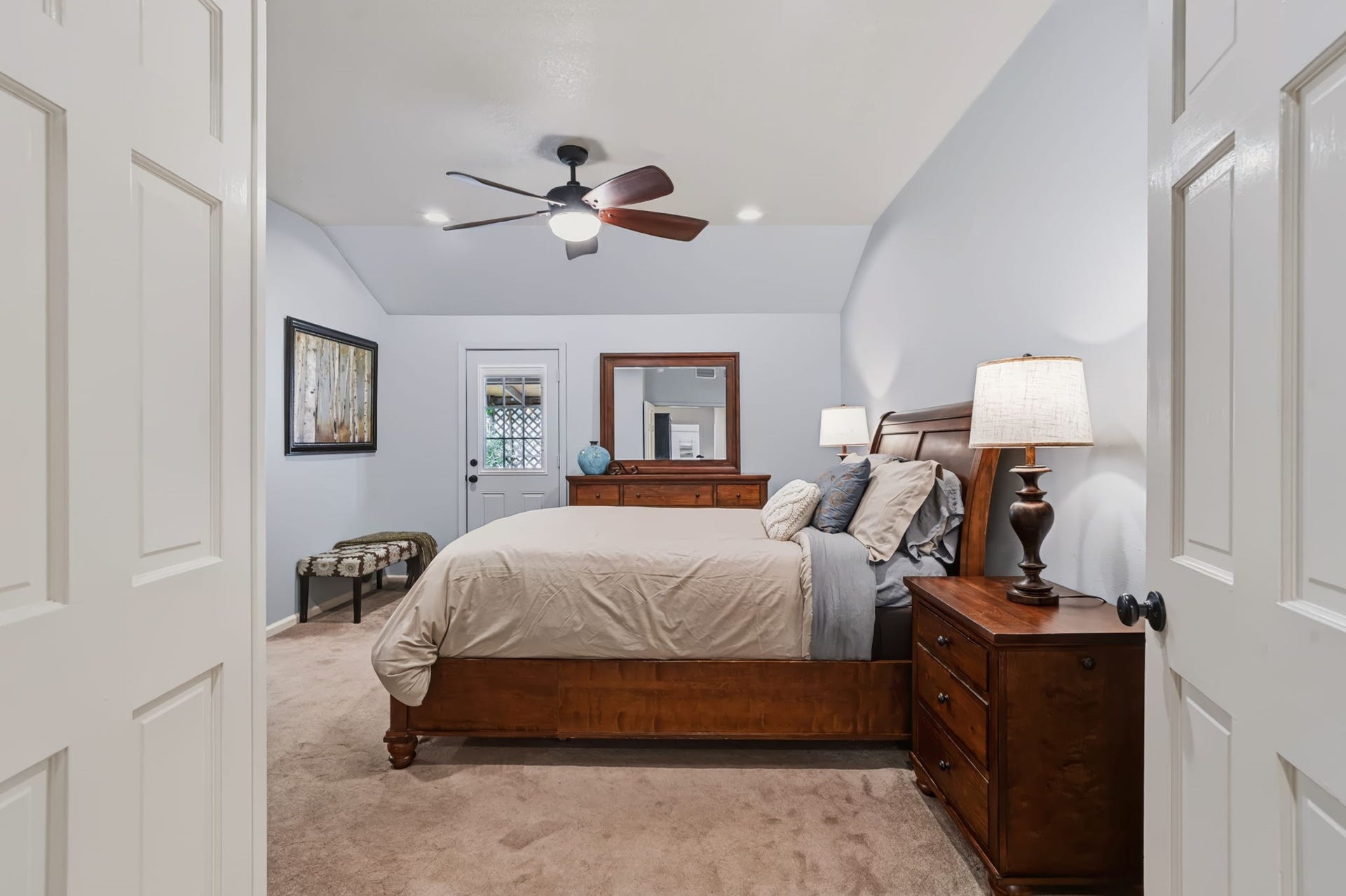 1802 Brushy Creek Drive, Sugar Land, TX 77478 The spacious 17 x 13 primary bedroom features a door leading to the patio, creating a lovely connection to the outdoors, along with a private en suite bathroom.