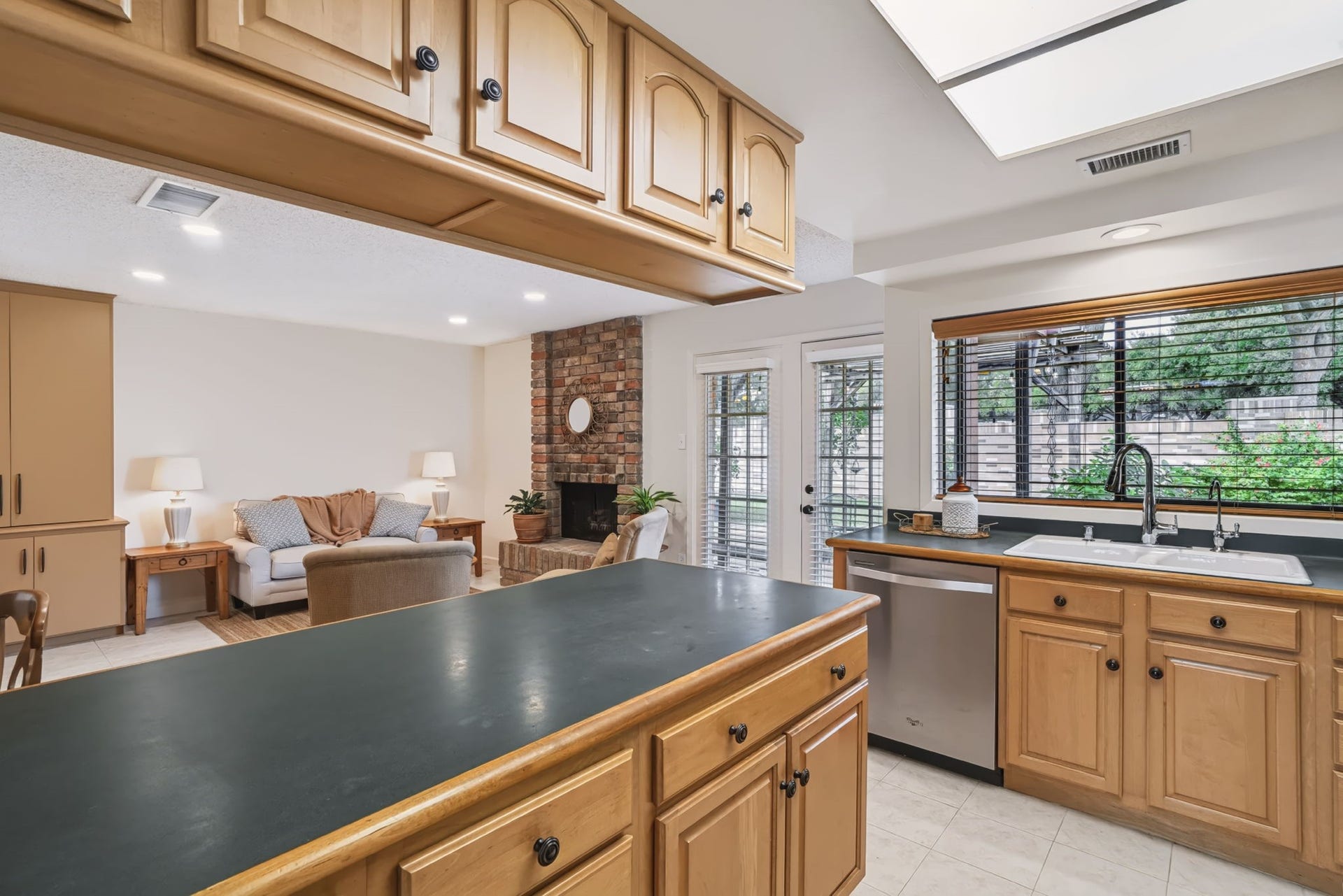 1802 Brushy Creek Drive, Sugar Land, TX 77478 Ample countertop workspace and cabinetry provide plenty of room for meal prep, storage, and keeping everything organized.