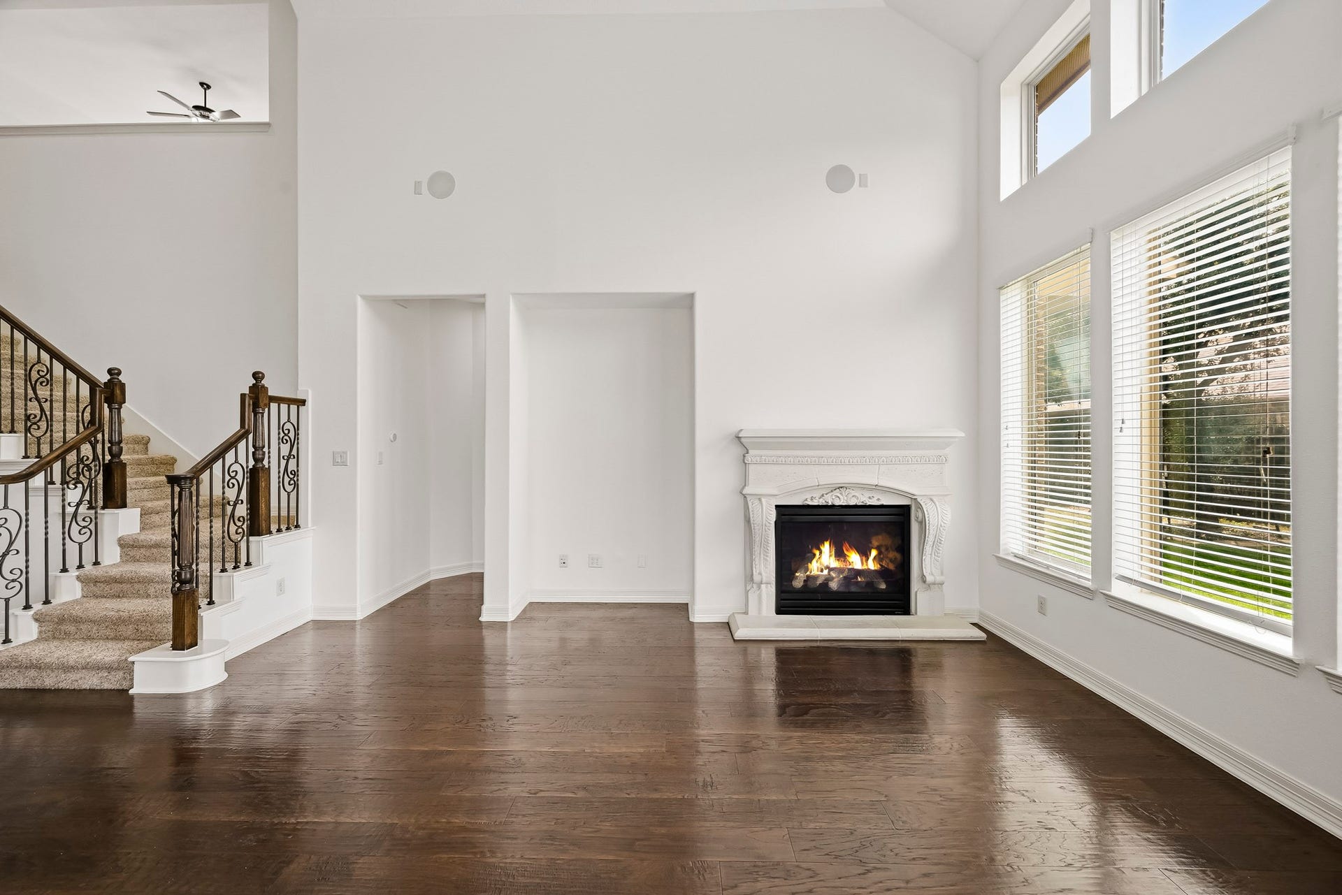 27730 Dalton Bluff Court, Katy, TX 77494 A fireplace, ceiling fan, recessed lighting, and multiple windows enhance the bright, inviting atmosphere.
