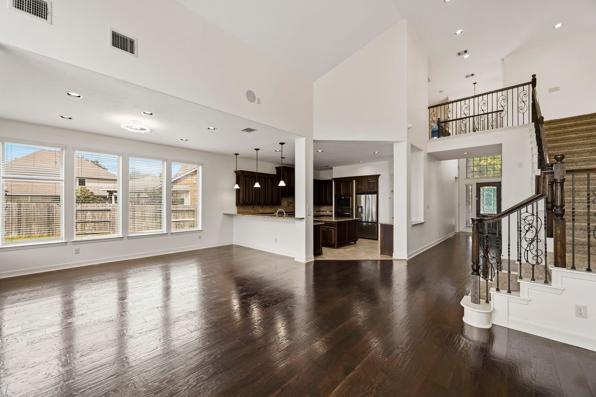 27730 Dalton Bluff Court, Katy, TX 77494 This impressive open-concept living space features soaring ceilings.