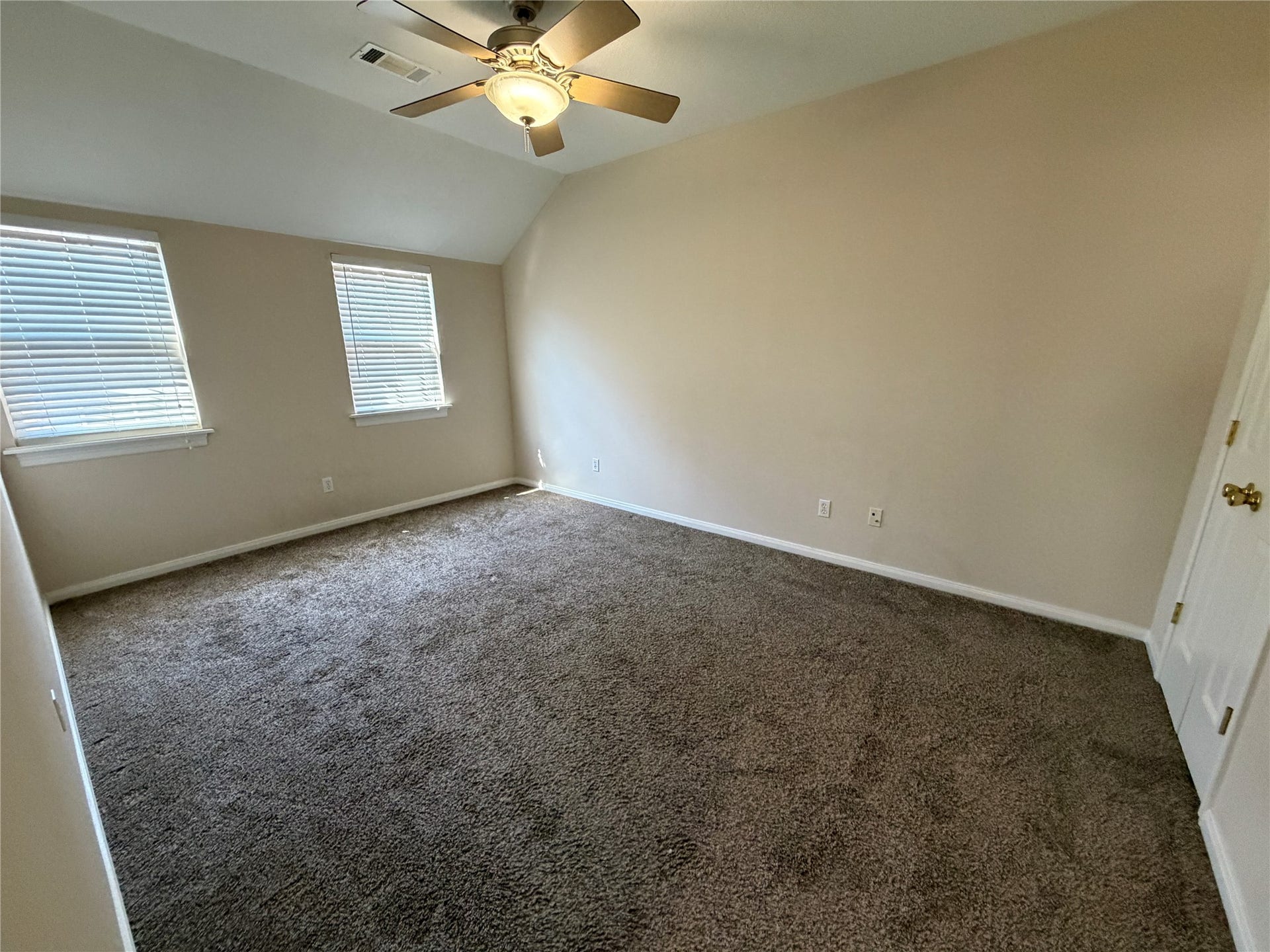 The other secondary bedroom on the second floor. All the bedrooms contain ceiling fans.
