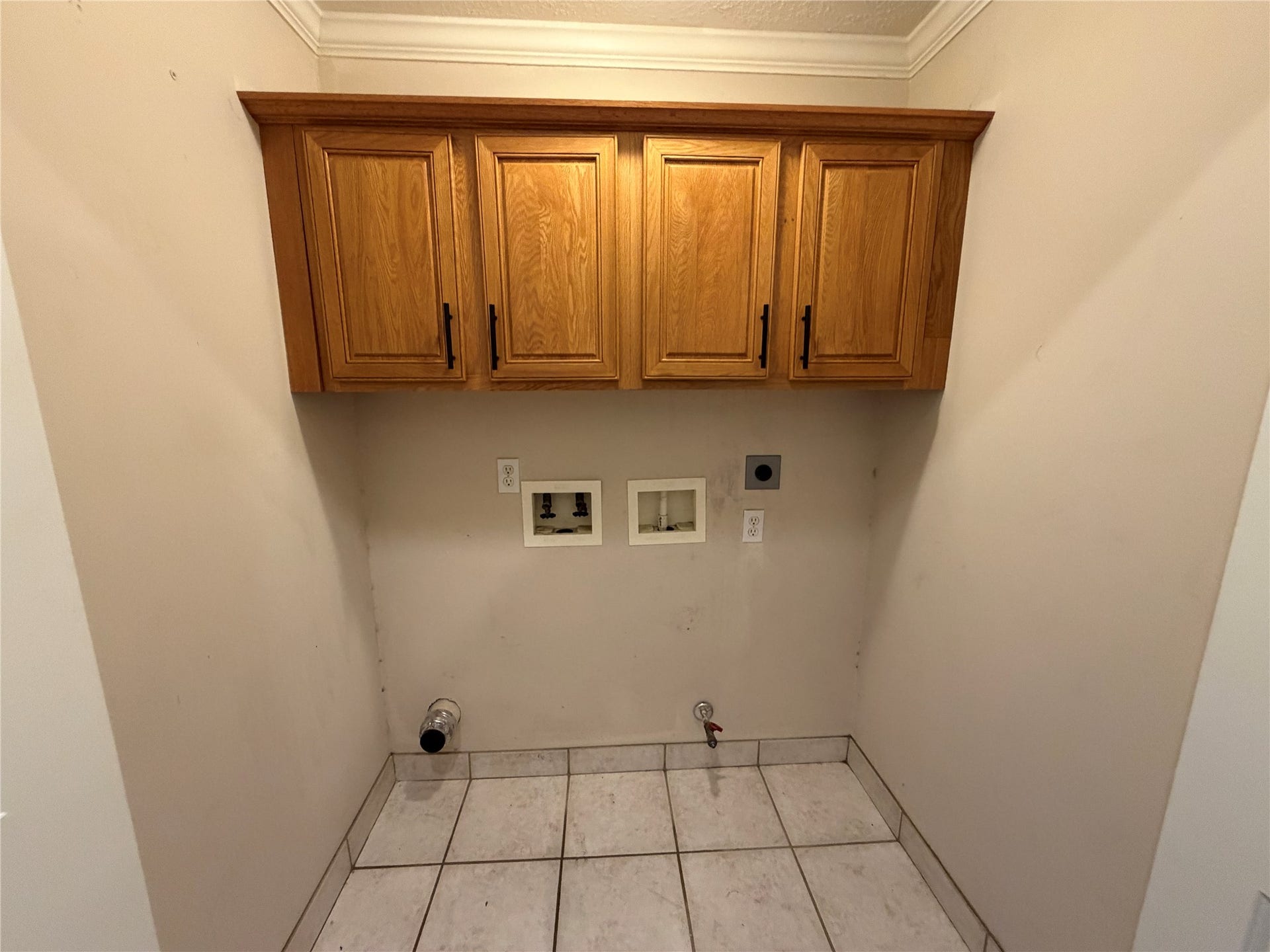 The is the laundry room located on the first floor with gas and electric connections for the dryer.