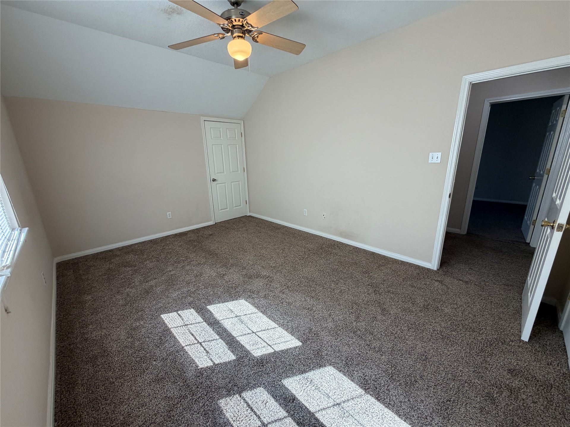 This is one of two secondary bedrooms upstairs with access to one of two attic storage spaces.